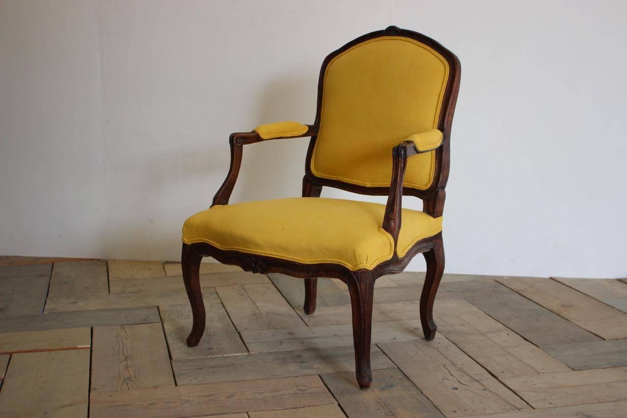 A very elegant, 18th century French Louis XVI fauteuil, having been reupholstered by us in a 19th century hand dyed linen.