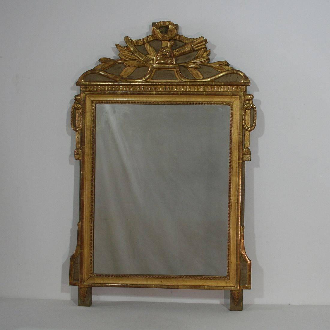 Great Louis XVI giltwood mirror, France, circa 1780. Weathered , small losses