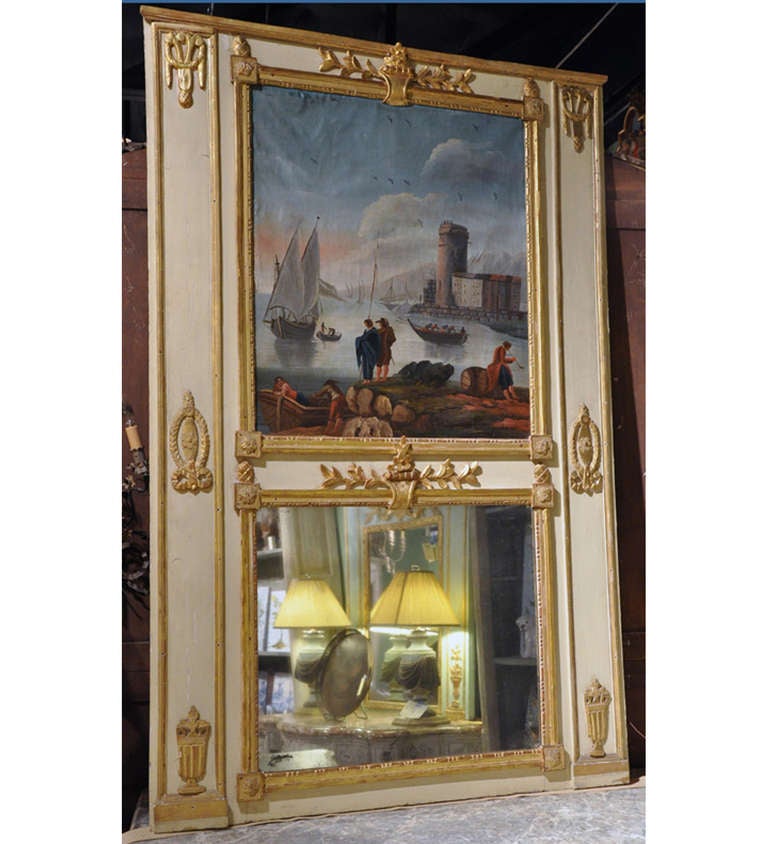 Add beauty and elegance to your living room with this elegant antique trumeau, crafted in Versailles, France, circa 1770, the mirror has sharp, clean lines with a beige hand painted frame with some gold leaf carved mounted decorations. Above the