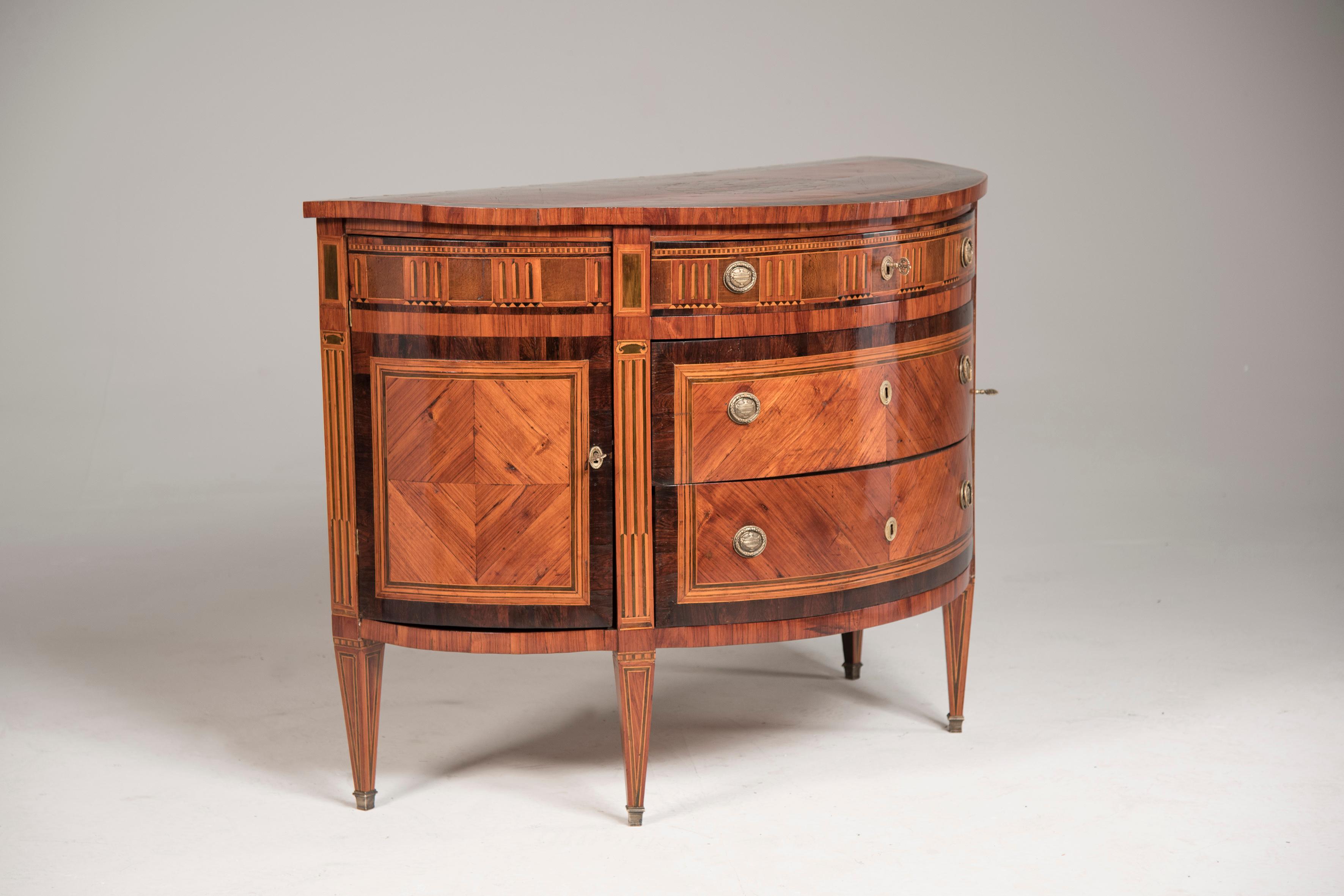 This 18th century French Louis XVI demilune (half moon) shaped marquetry sideboard or chest of drawers dates back to Louis XVI period (1774 -1791) and it features great scale, perfect proportions and stunning high craftsmanship marquetry inlays in
