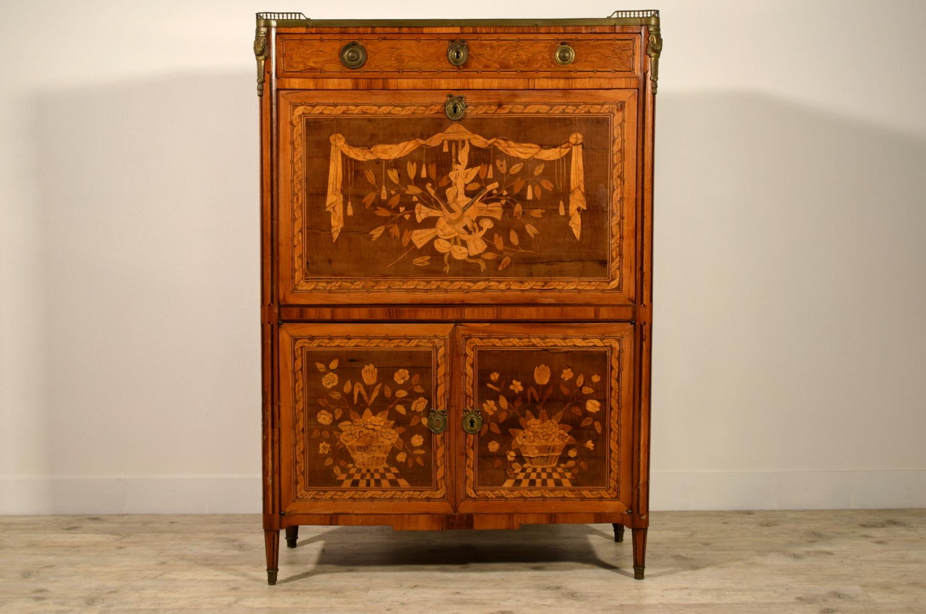 18th century, French Louis XVI inlaid wood secretaire with marble top and gilt bronzes.

This elegant secretaire Louis XVI was made in France in the second half of the 18th century.
The cabinet is finely inlaid with wooden essences of different