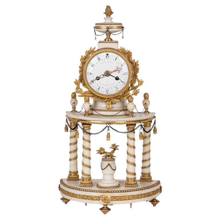 An 18th Century Gilt Bronze French Portico Clock An 18th Century Gilt Bronze French Portico Clock