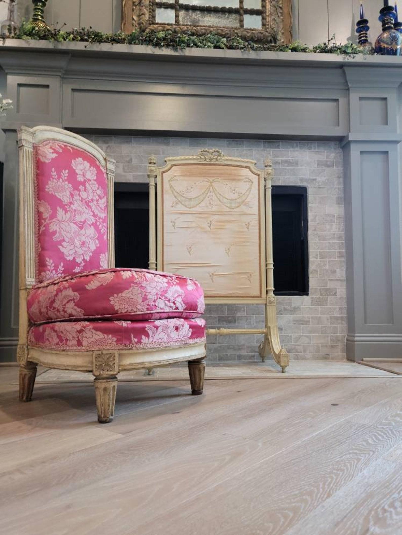 A period Louis XVI (1772-1792) French boudoir fireside chair, characterized by elegance, lightness and simplicity of form, and reflecting the final era of royal opulence before the upheaval of the French Revolution, this beautiful petite antique low