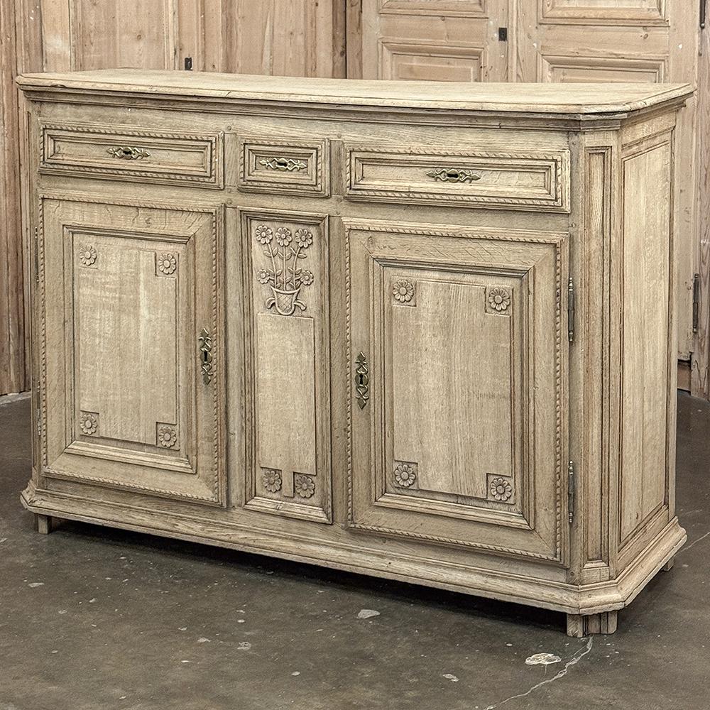 18th Century French Louis XVI Period Buffet in Stripped Oak is a timeless example of rural artisans emulating the styles set by the Royal Family during previous centuries.  Around the time of the American Revolution, such craftsmen utilized