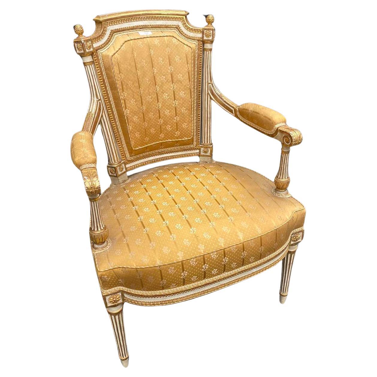 Rare authentic armchair made by Jean-Baptiste Boulard in the late 18th century. It is a very lovely piece hand carved and hand painted with great details upholstered in yellow to golden silk by Lelievre. Very good condition with no