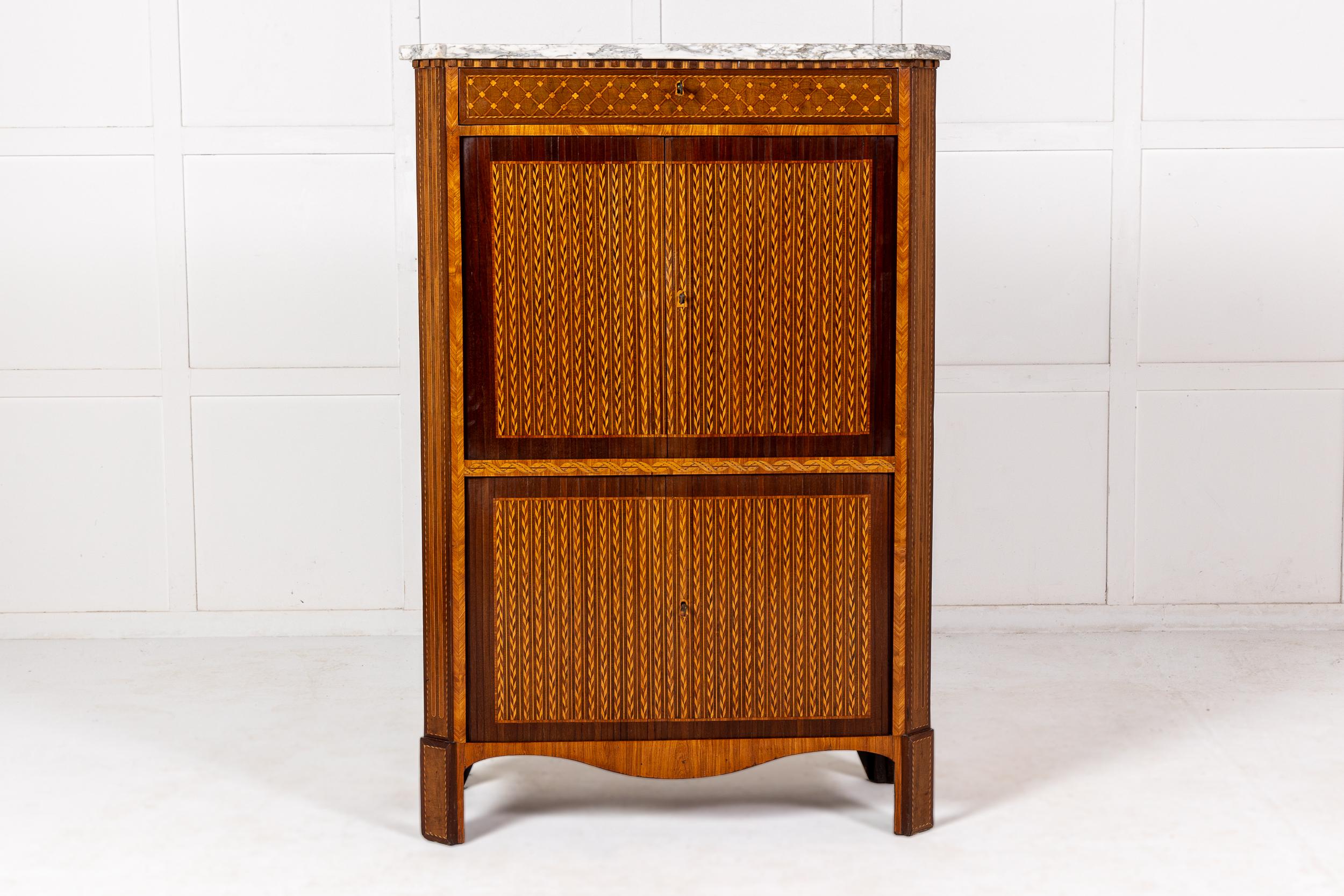 An Exceptional French Louis XVI Period Secrétaire à Abattant with Parquetry Detailing and Marble Top.

This outstanding piece of furniture is veneered primarily in amaranth and tulip wood with a large number of parquetry motifs used throughout. The