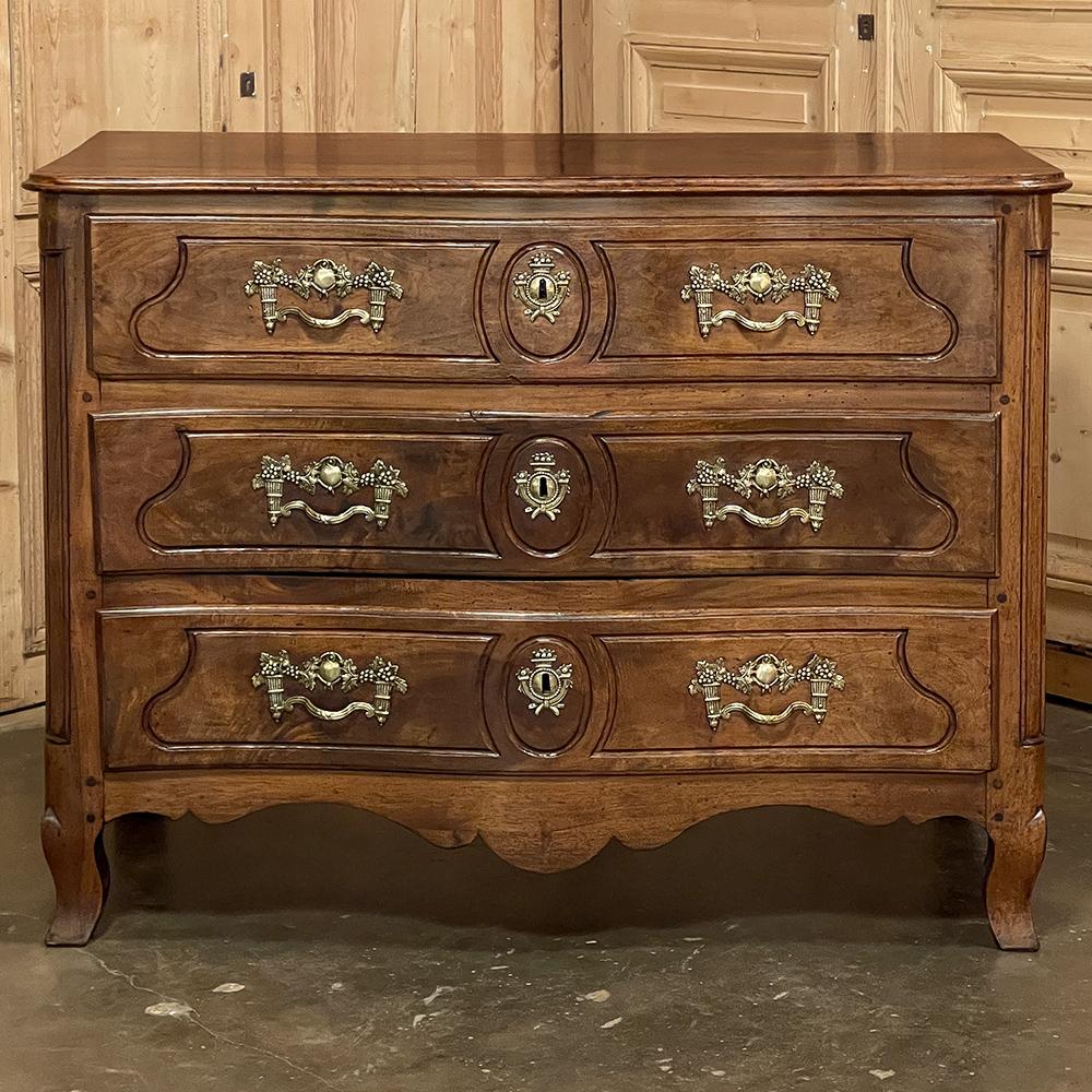 18th Century French Louis XVI Period Walnut Commode is a superlative example of the beginnings of the neoclassical revival in Europe that occurred with the transition from Kings Louis XV and Louis XVI. The casework shows a subtle bowed front and