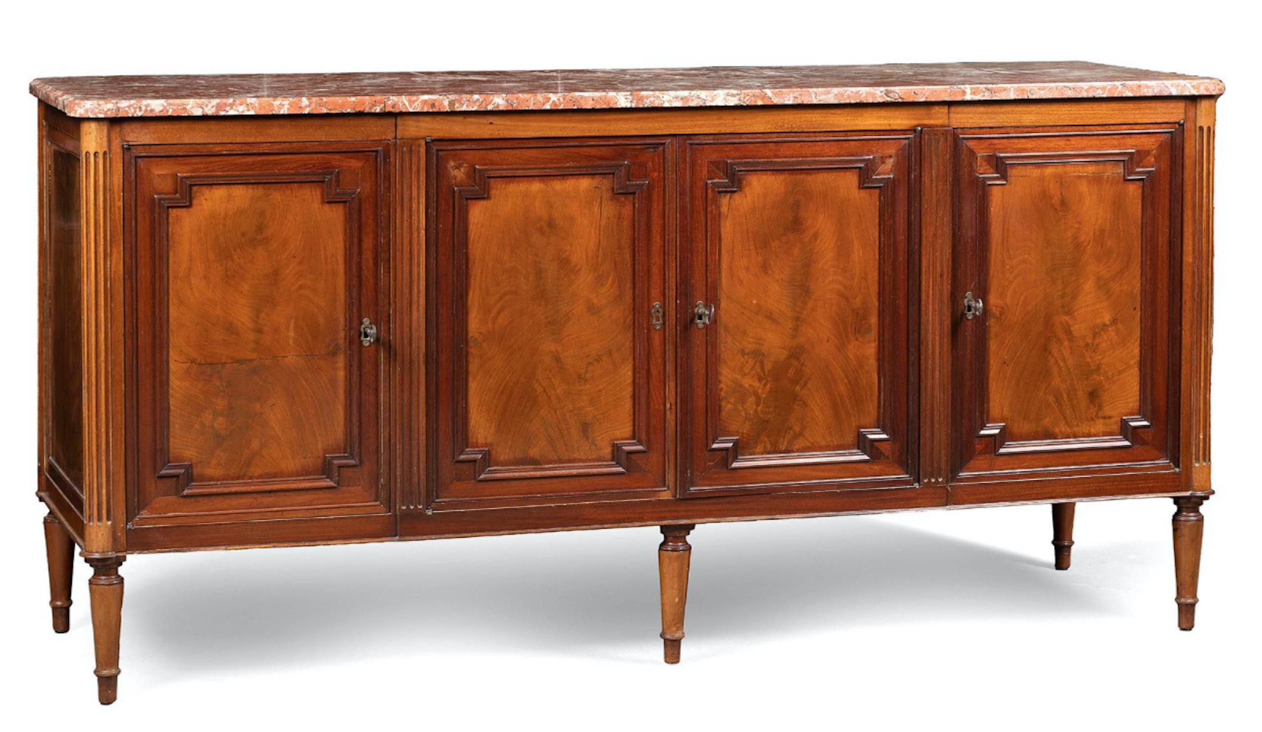 Row buffet in moulded and veneered solid oak and mahogany. Front part is made with a slight central opening projection by four leaves, punctuated by fluted uprights, those at the ends rounded, and resting on five tapered legs, three in front and two