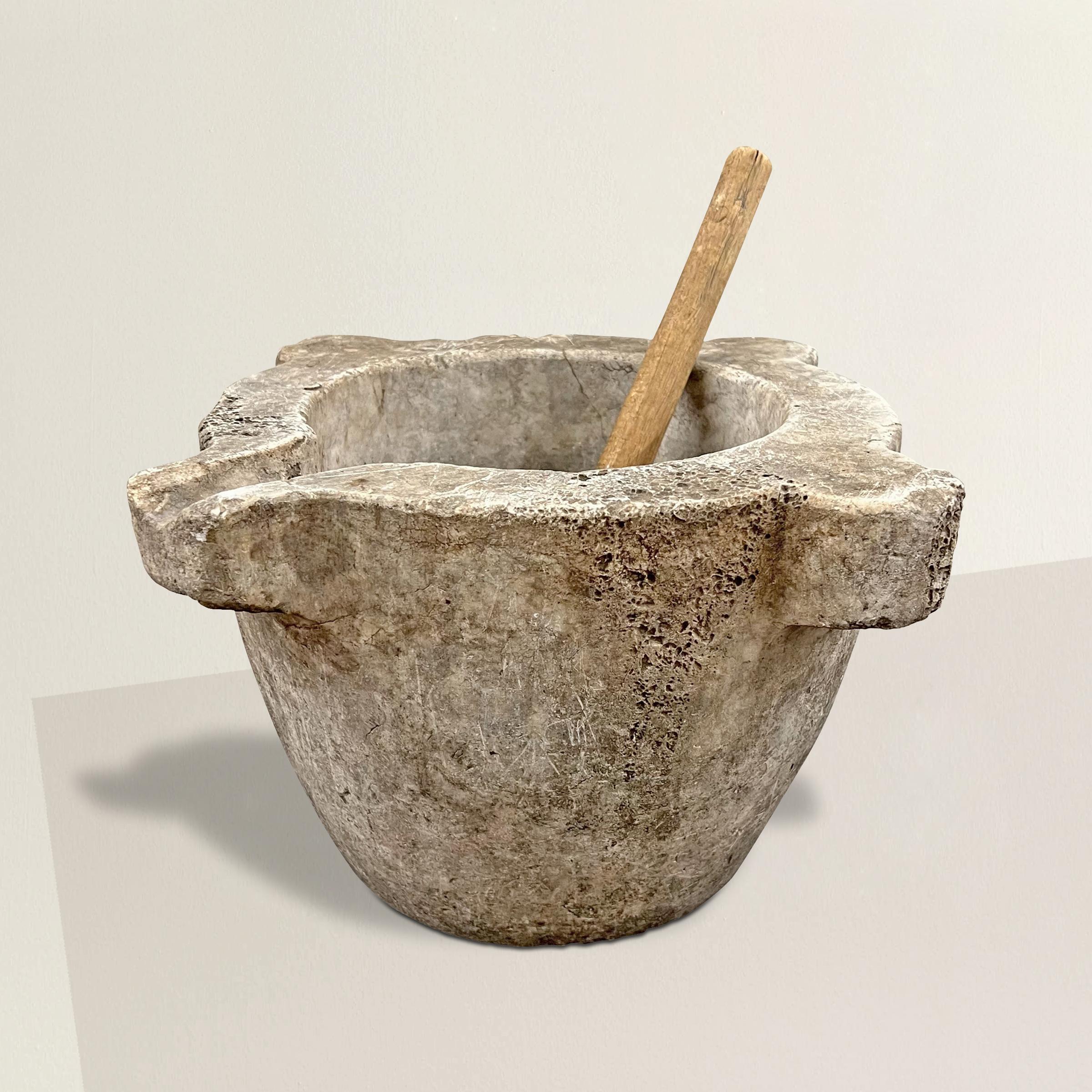 A stunning 18th century French marble mortar with the best worn surface we've seen in years, with a tiger maple pestle. The perfect accessory for your kitchen. Fill with fruits and vegetables on your island, or put it to use at the end of summer