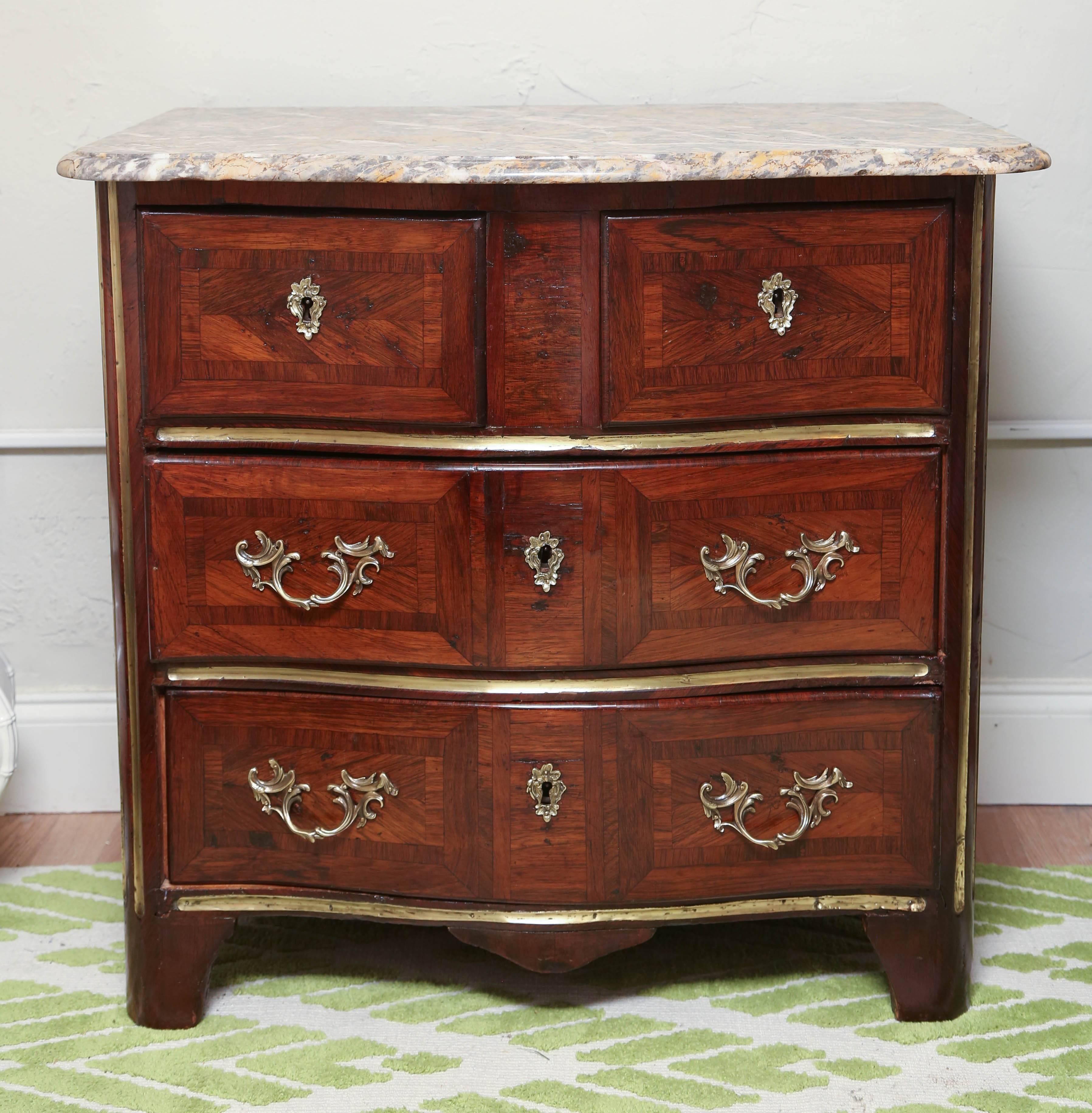 18th century four-drawer commode with marble top and original pulls and key holes.