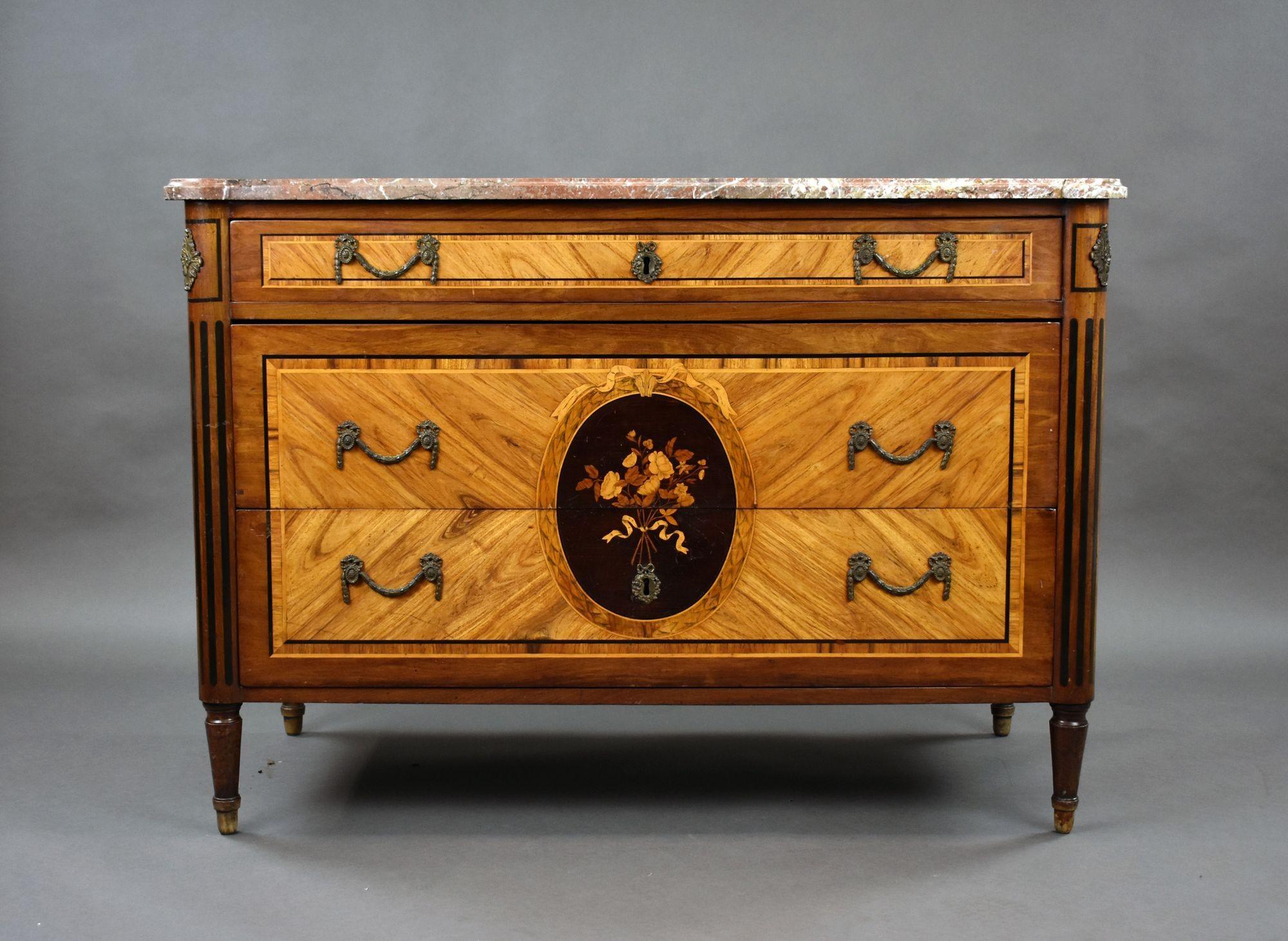 For sale is a fine quality 18th century French marble topped commode, having fine kingwood veneers, the commode has an arrangement of three drawers, each with ornate brass handles, the bottom two drawers are intricately inlaid with various woods.