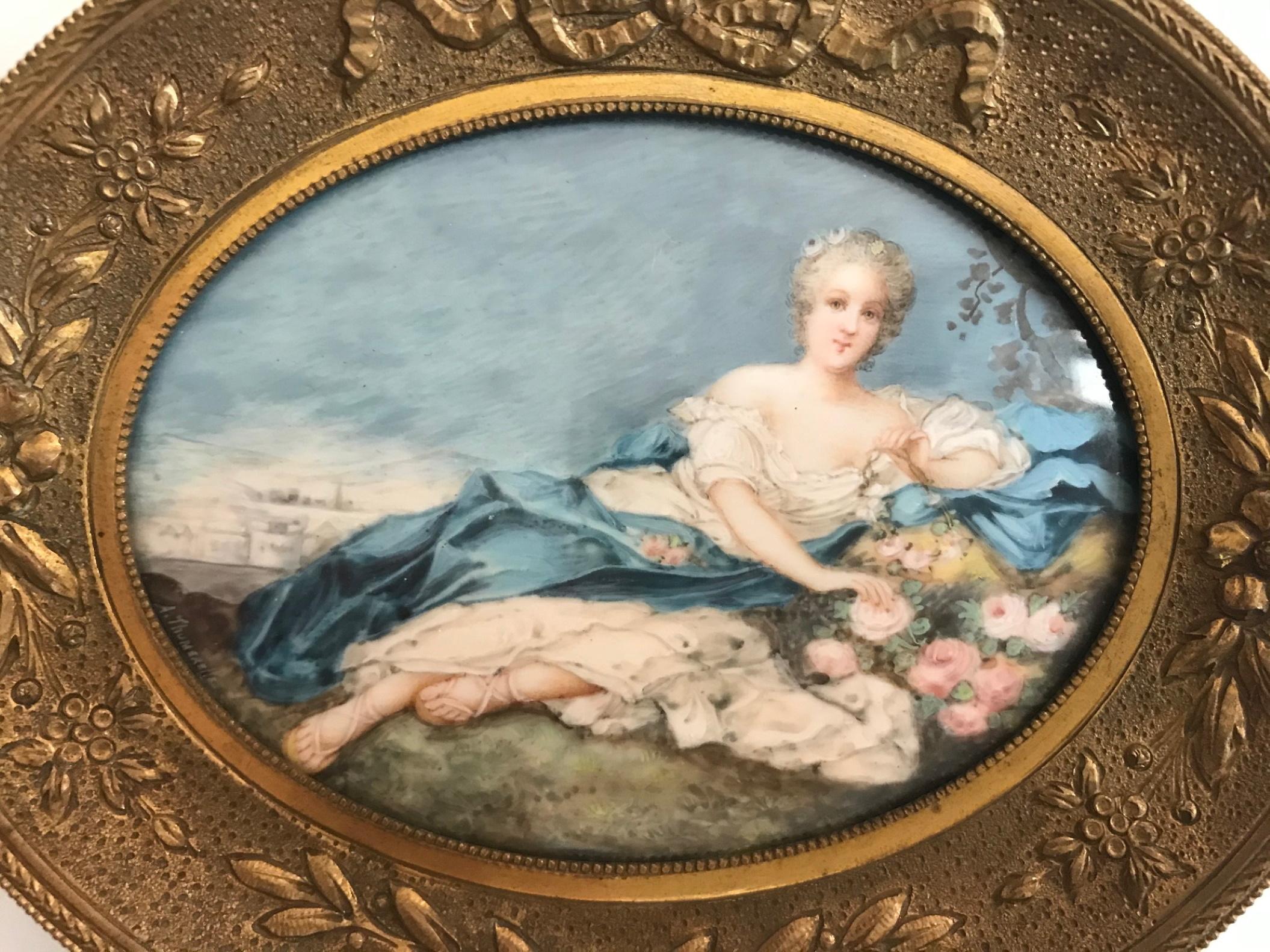 18th century French miniature genre painting in ormolu frame.

This beautifully executed oval miniature Boucher style painting depicts a young lady reclining on a flower bed. This exceptional French 18th century period miniature is incredibly