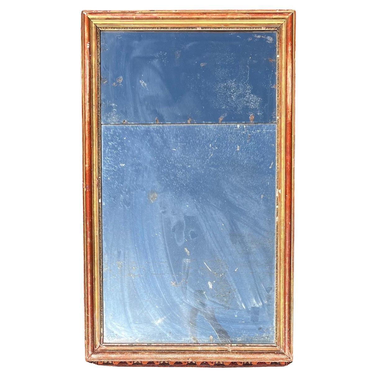 Specchio da parete a pannello diviso di grandi dimensioni in stile neoclassico francese del XVIII secolo.

Impressionante specchio in legno dorato del XVIII secolo con pannello originale diviso. La cornice in legno dorato riflette l'effetto usurato