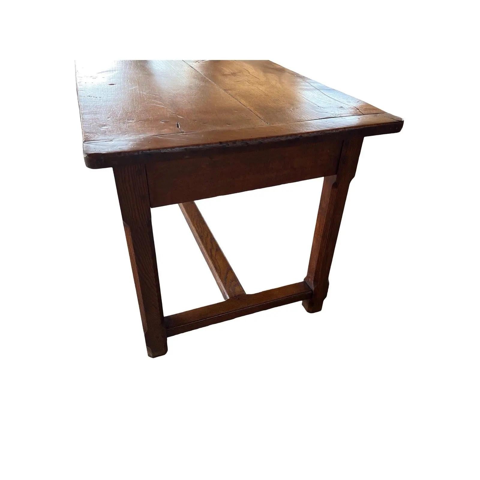 Farm table hand-made in France in the mid 1700s using oak and pegged construction. The table has a beautiful warm color and great proportions. Measuring more than 2 mt in length this is a table that will accommodate many guests or be used to prep a