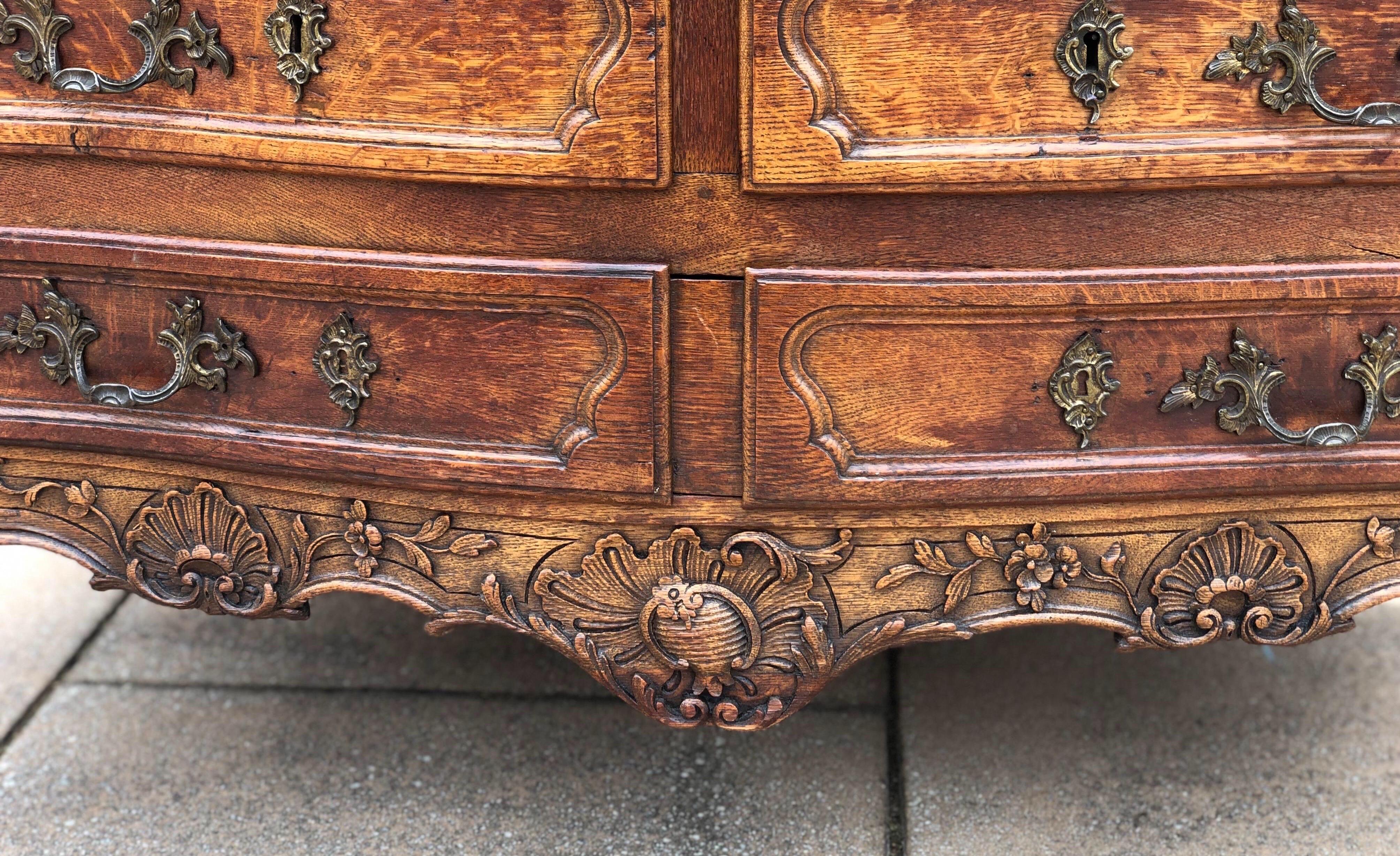 French Provincial 18th Century French Carved Oak Serpentine Commode on Hoof Feet For Sale