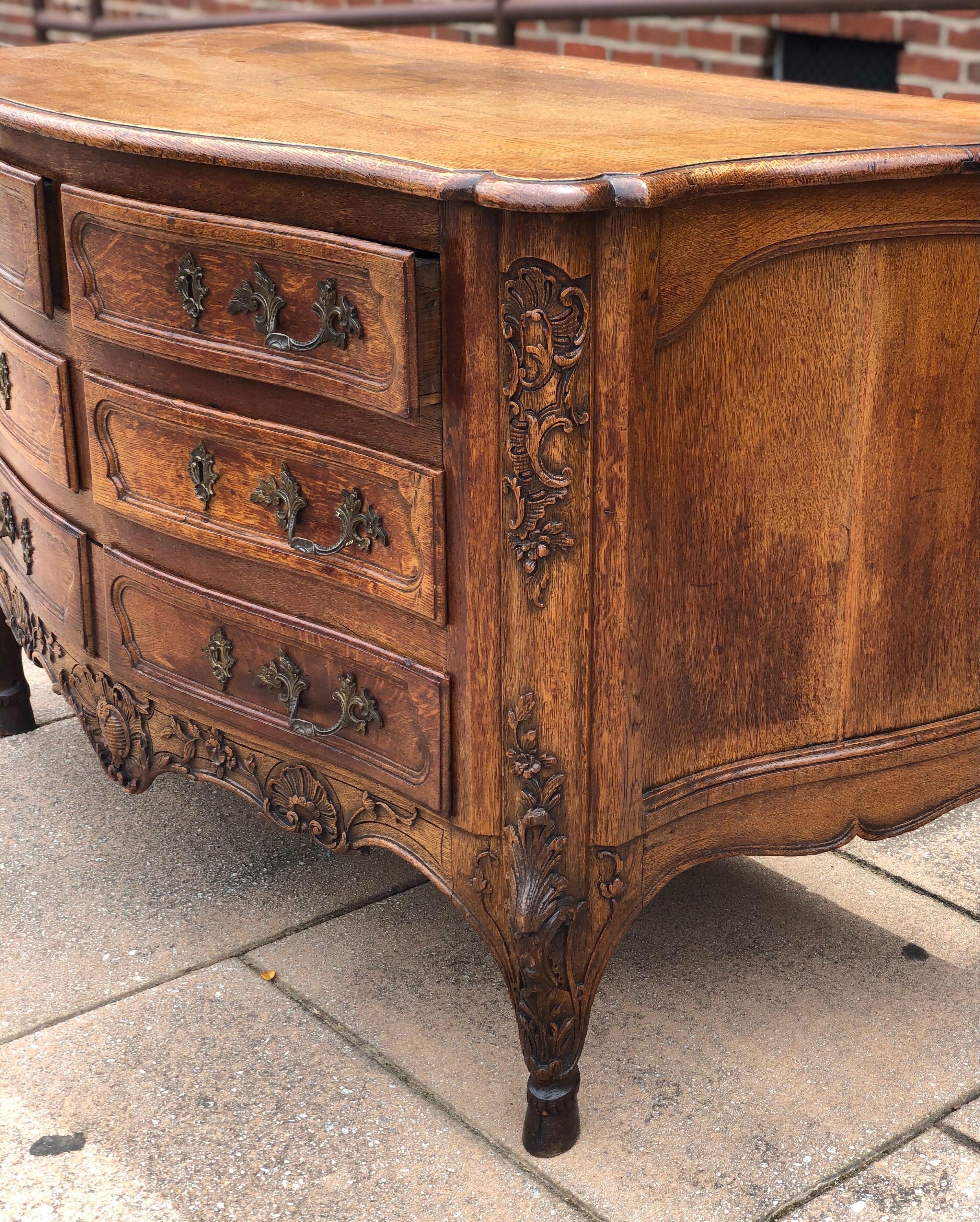 18th Century and Earlier 18th Century French Carved Oak Serpentine Commode on Hoof Feet For Sale