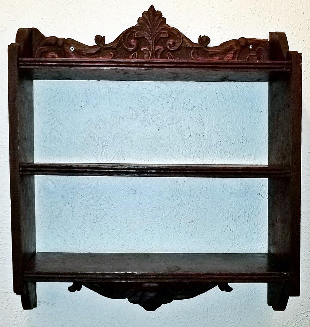 Presenting a beautiful old French piece.

This is an 18th century hand carved, oak wall shelf in the French Provincial style.

Two beautifully carved sides with heart shaped acanthus leaves with 2 open shelves to the front and a third topped by