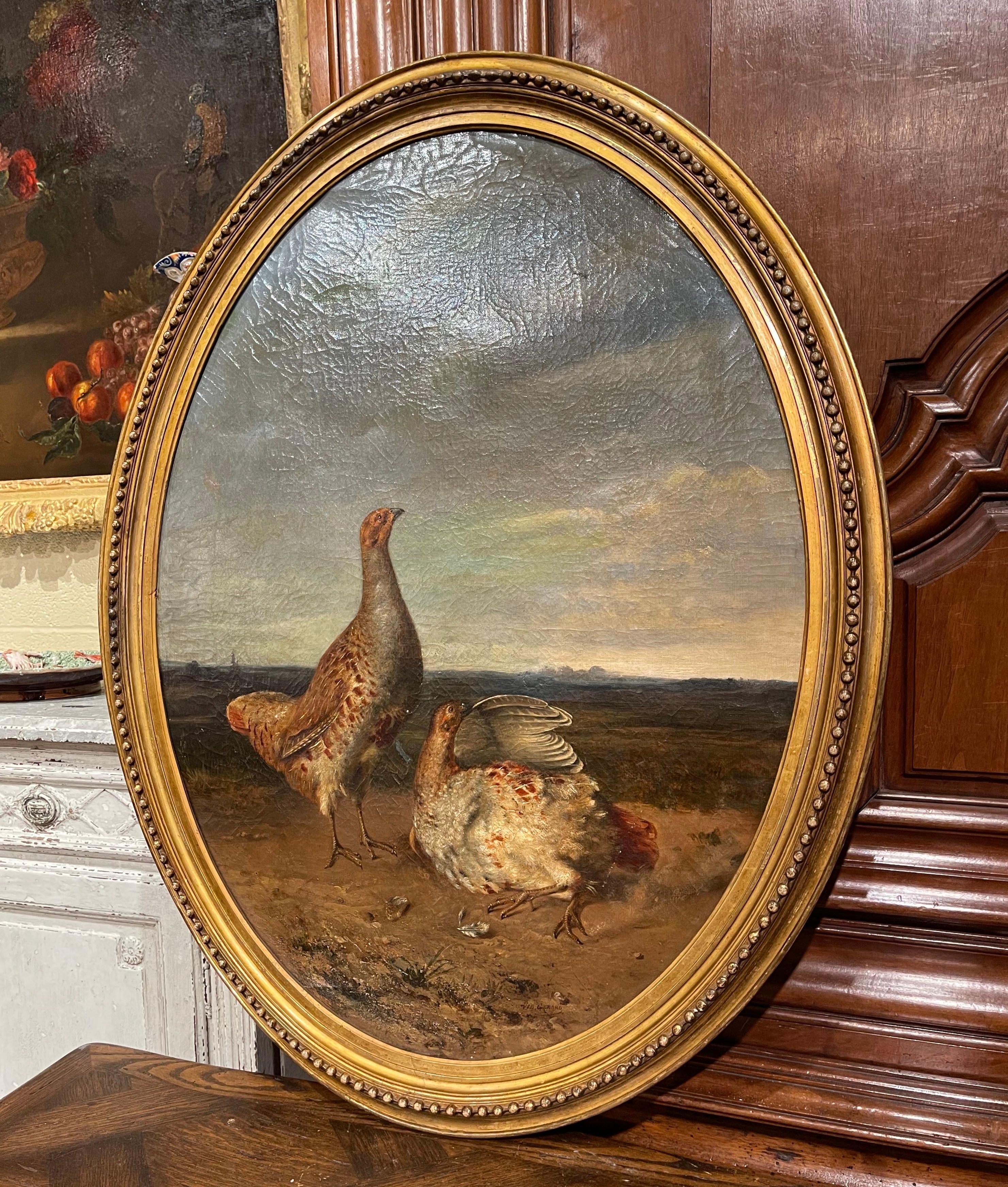 Decorate a ranch or hunting lodge with this elegant antique painting from France circa 1780. Set in the original oval gilt frame decorated with bead motifs, the realistic oil on canvas painting depicts two pheasants in a landscape. Signed in the