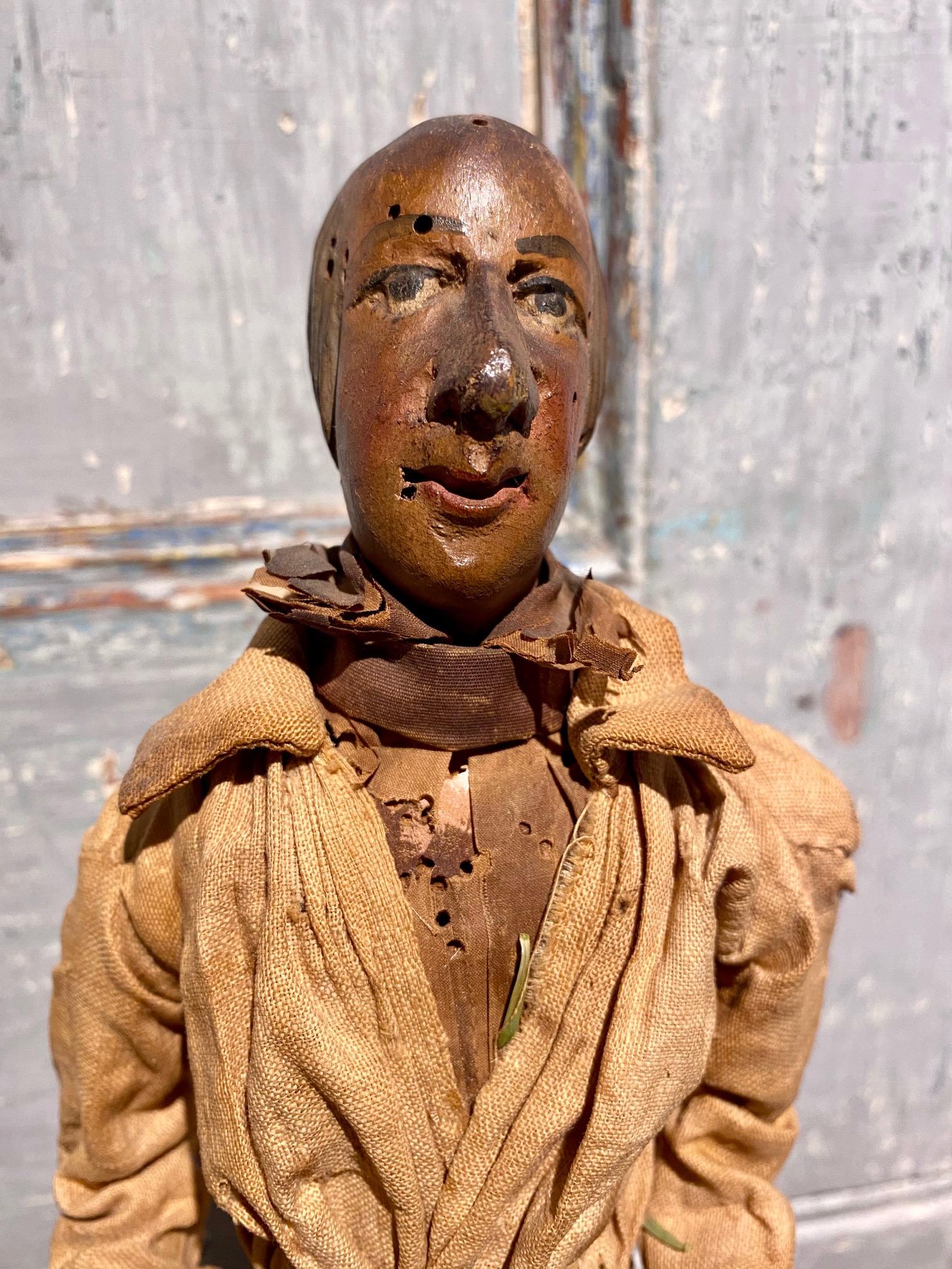 18th century French or Italian Santo Nativity Figure, a hand carved and painted fruitwood figure for a Christmas Crèche or Krippe. Excellent and delicate details to the head and hands. The half figure stands on a dowel set into platform base,