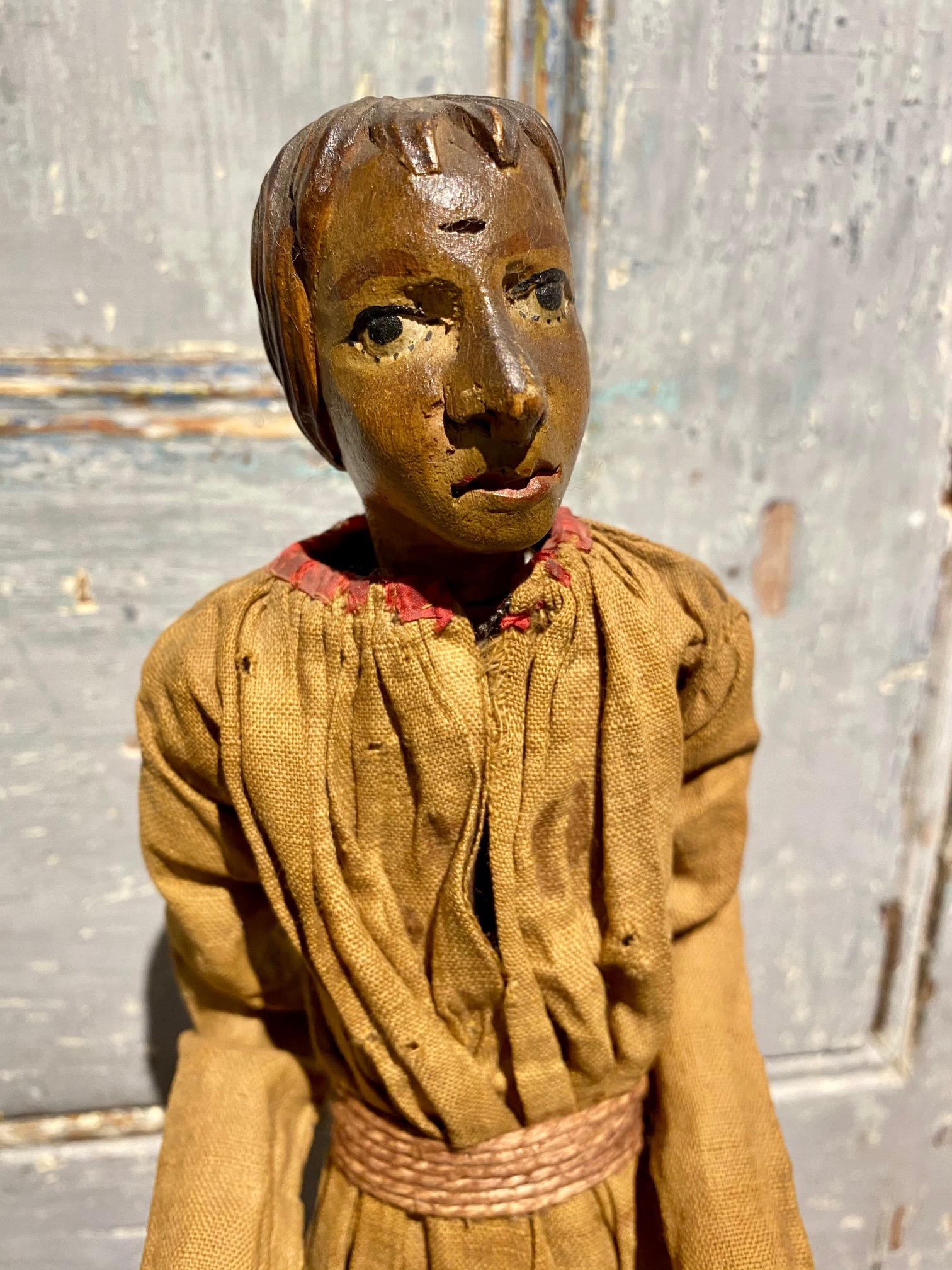 18th century French or Italian Santo Nativity figure, a hand carved and painted fruitwood figure for a Christmas Creche or Krippe. Excellent and delicate details to the head and hands. The half figure stands on a dowel set into platform base,