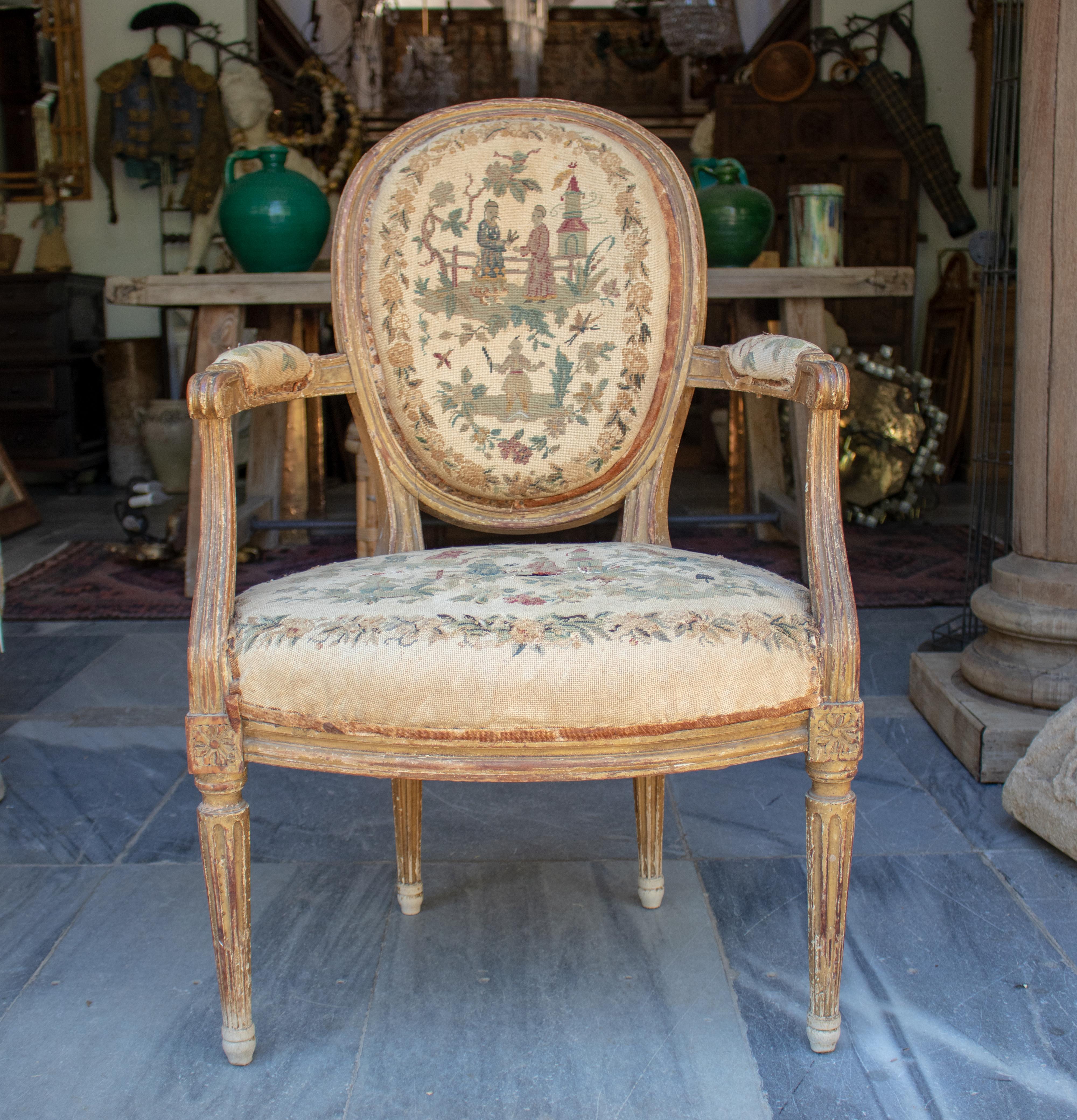 18th century French armchair upholstered with the original chinoiserie tapestry.
