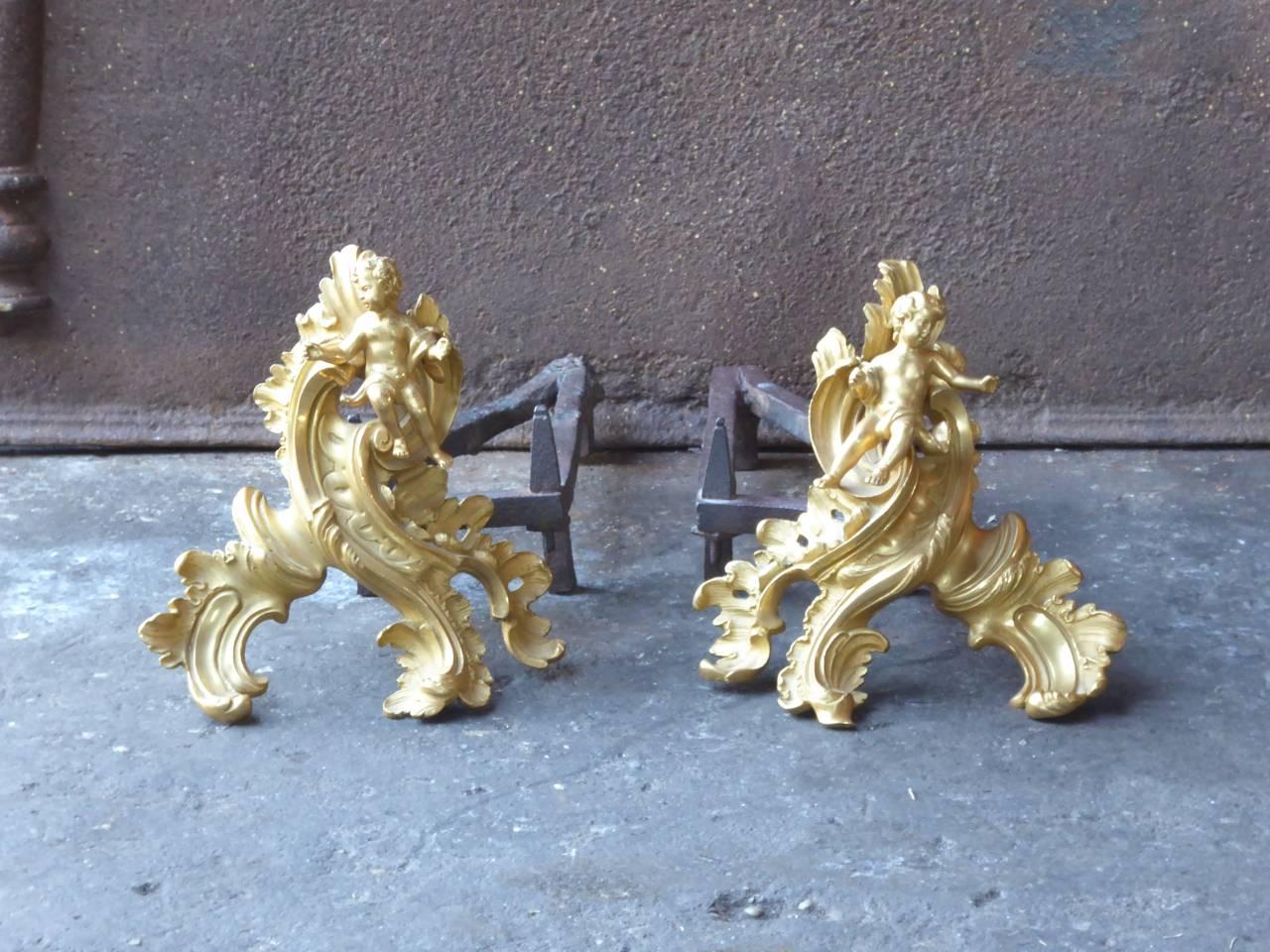 Beautiful 18th century French Louis XV firedogs made of ormolu and wrought iron. The condition is good.

One of the most valuable secrets of French metalworkers in the 18th and early 19th century was the gilding of brass and bronze, called ormolu.