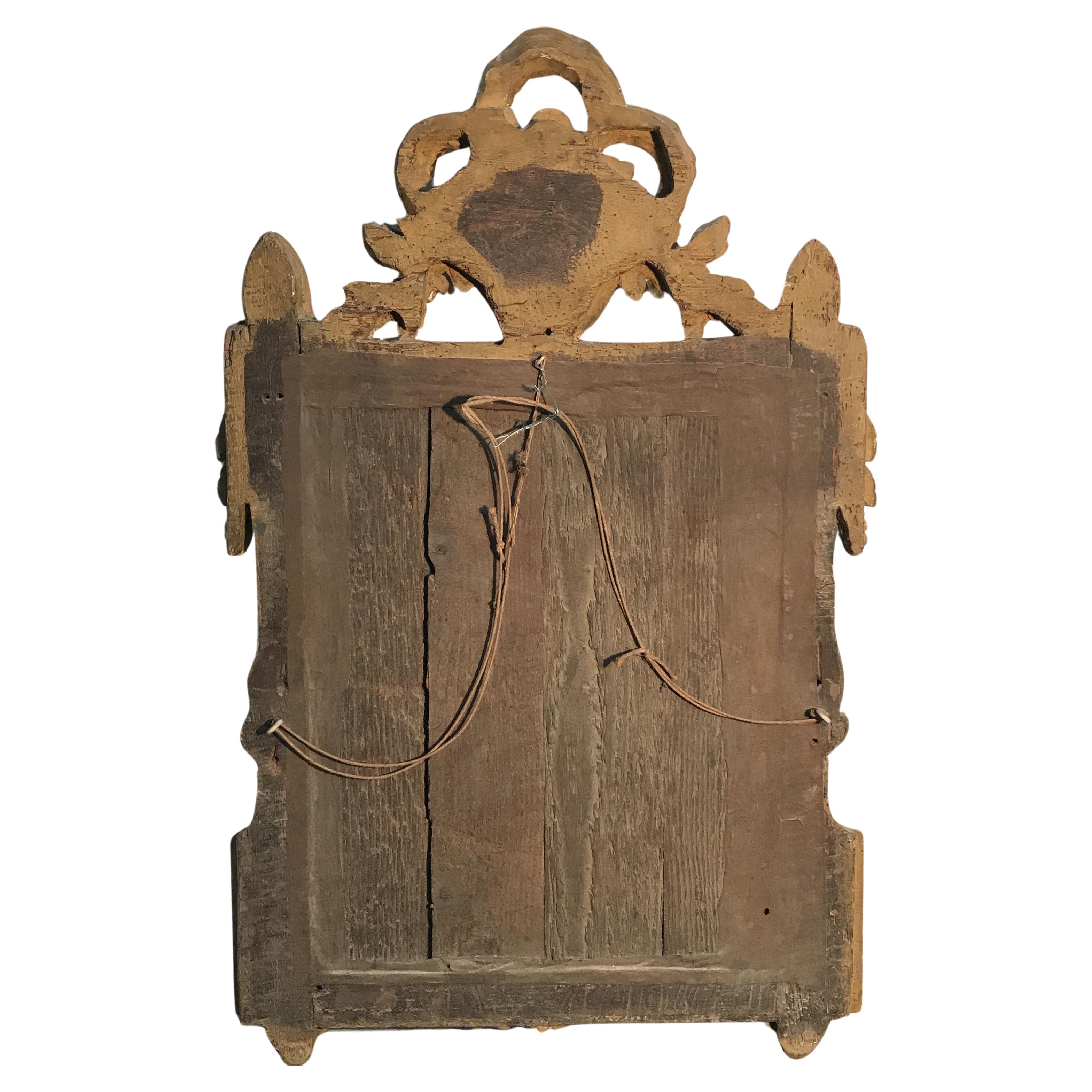 Magnifique miroir doré et orné du début du 18e siècle en France.
#4758