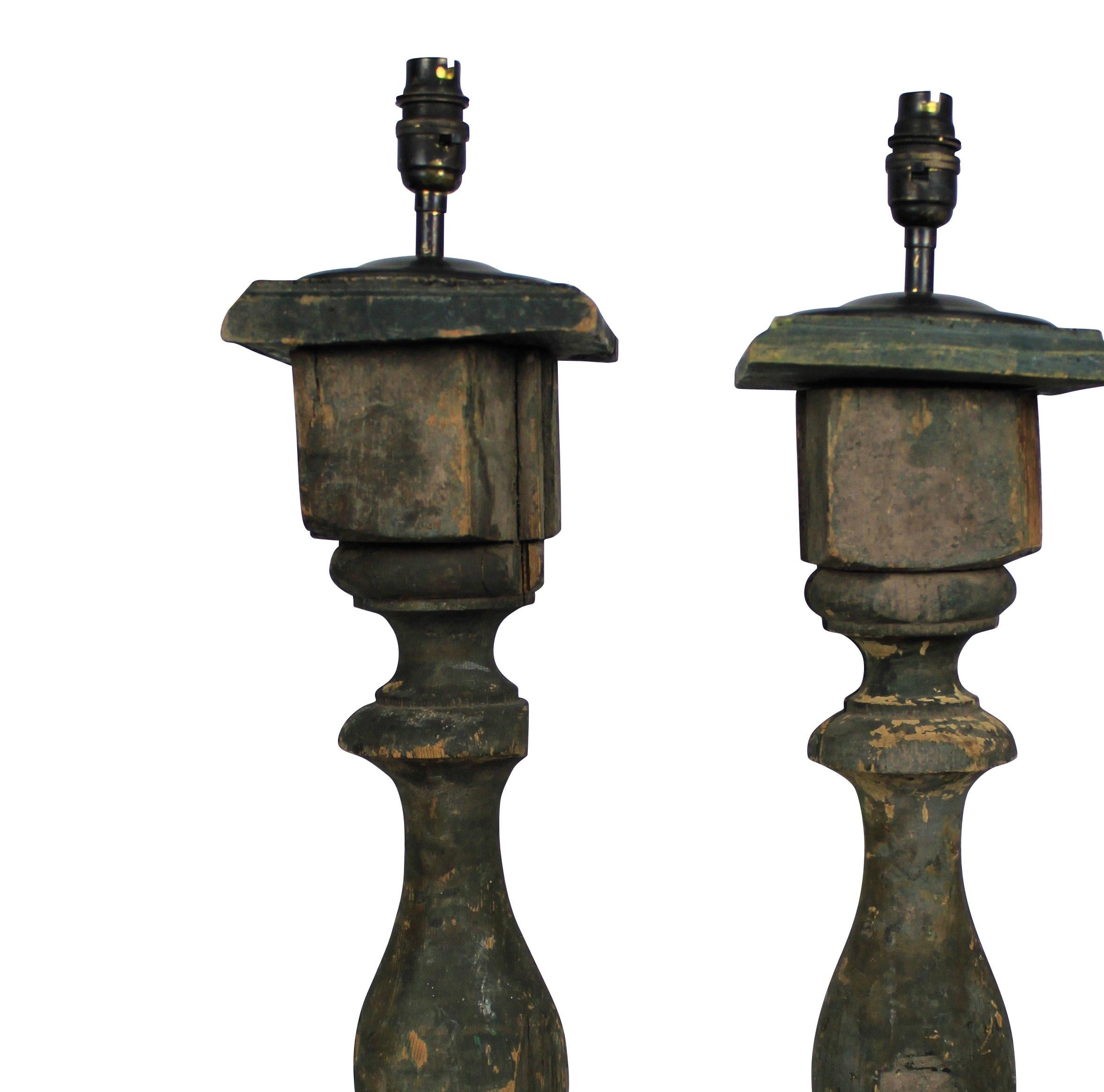 A pair of French green painted wooden balustrades, now as lamps.

 