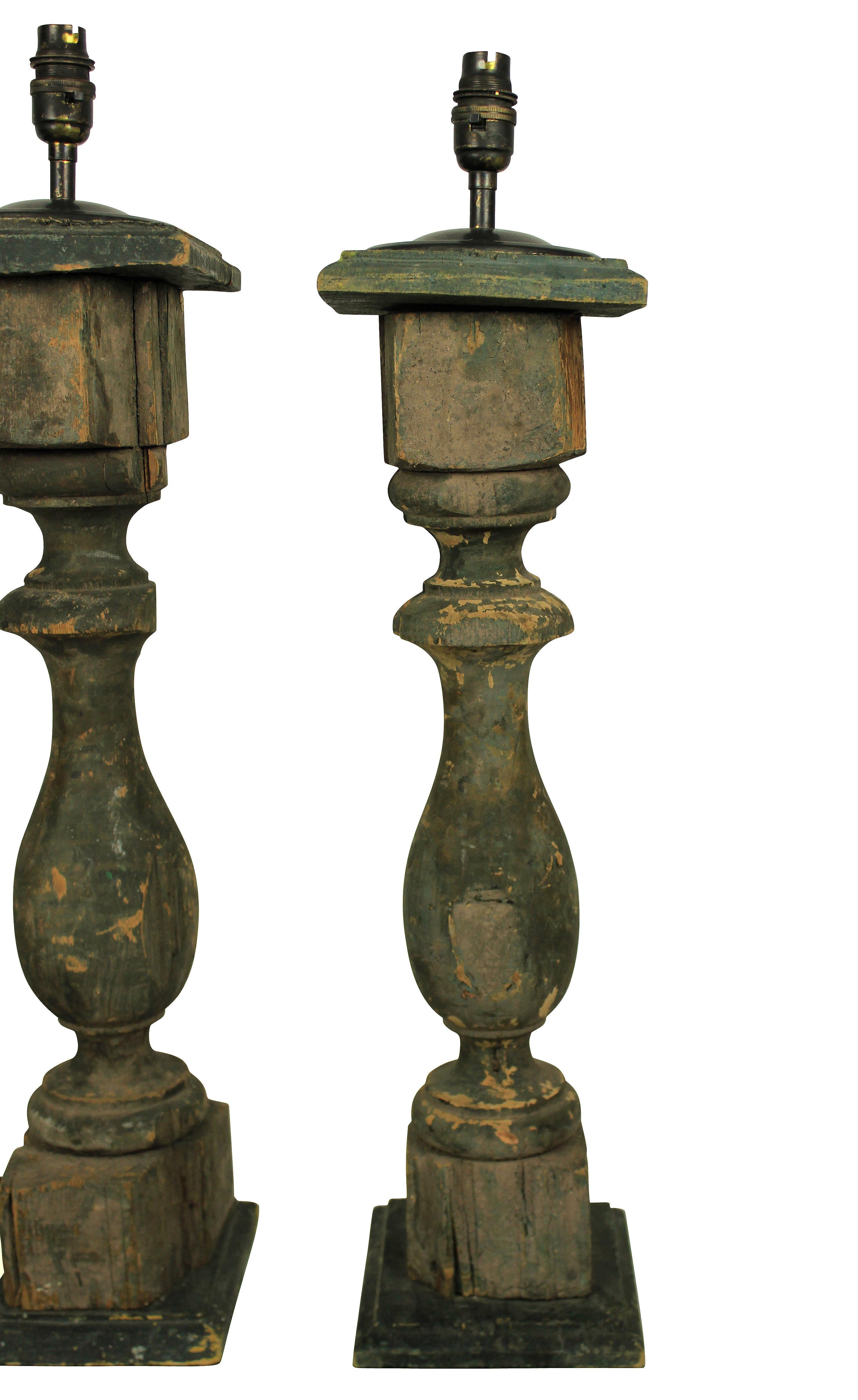 A pair of French green painted wooden balustrades, now as lamps.

 