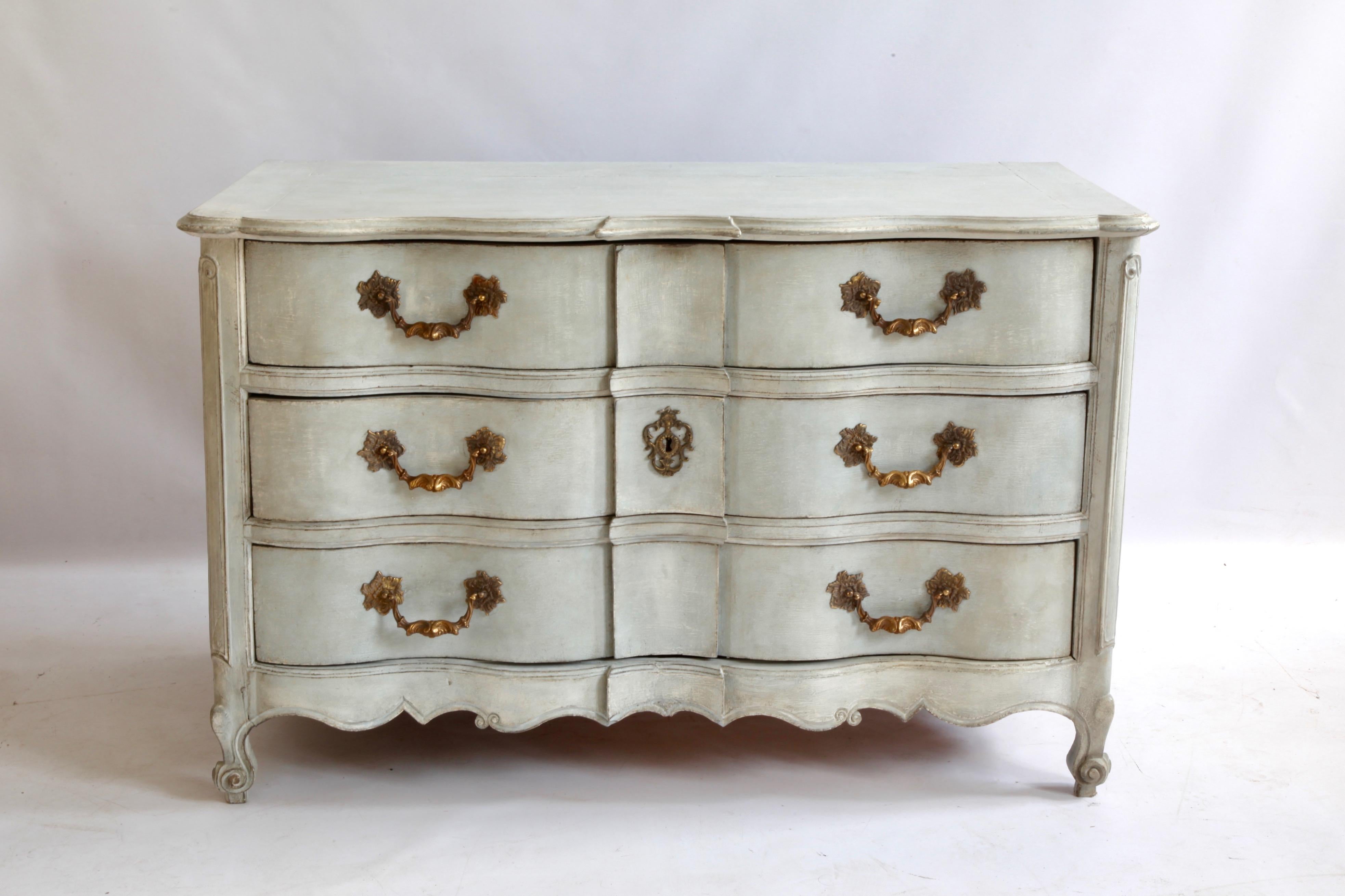 Louis XV Arbalette chest of drawers later painted in a French grey with bronze handles.