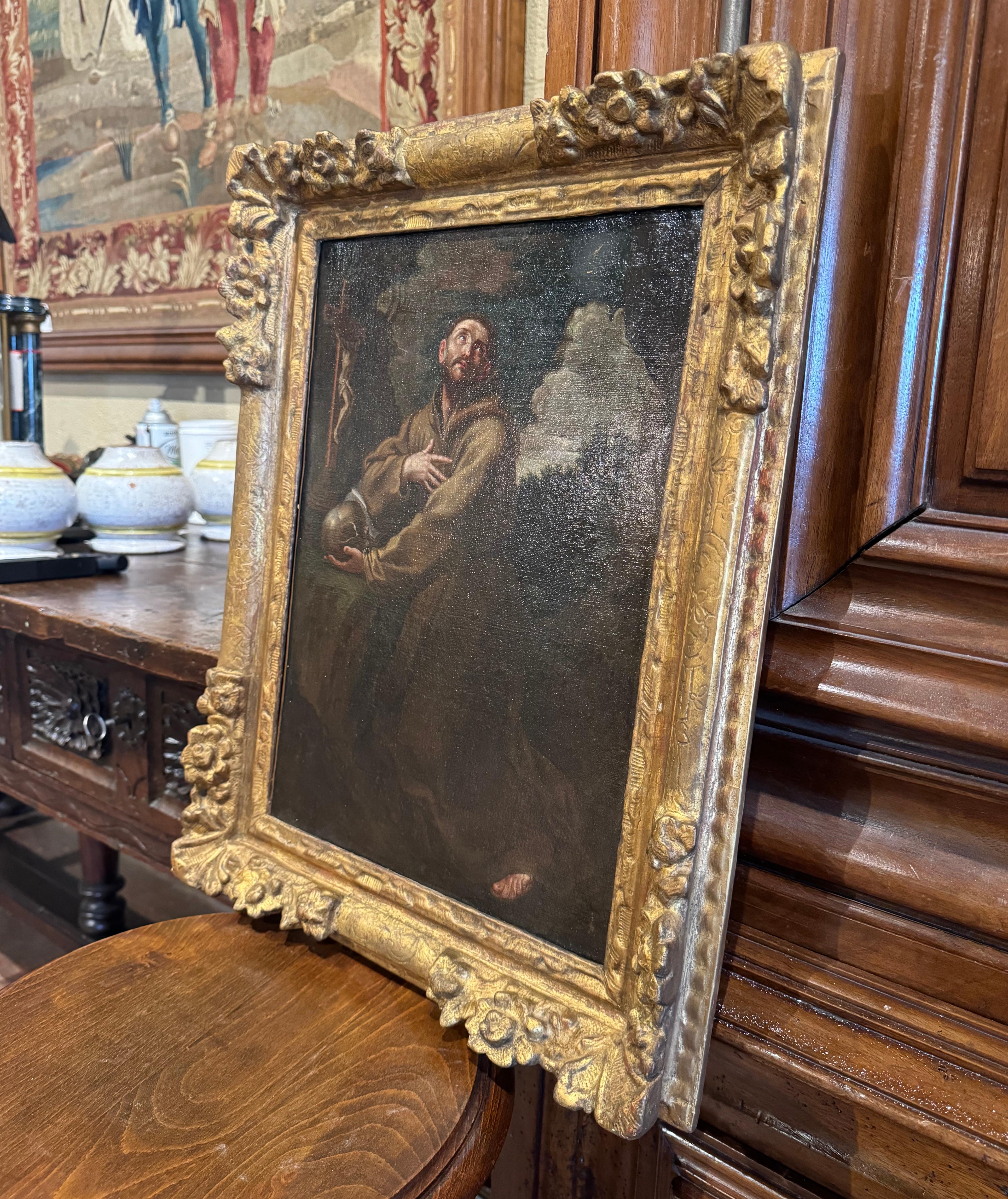 Dekorieren Sie eine Wand mit diesem schönen antiken Gemälde. Das in den originalen geschnitzten und vergoldeten Holzrahmen eingebettete Kunstwerk zeigt den heiligen Franz von Assisi bei der Meditation in einer religiösen Ekstase. Das Gemälde ist in