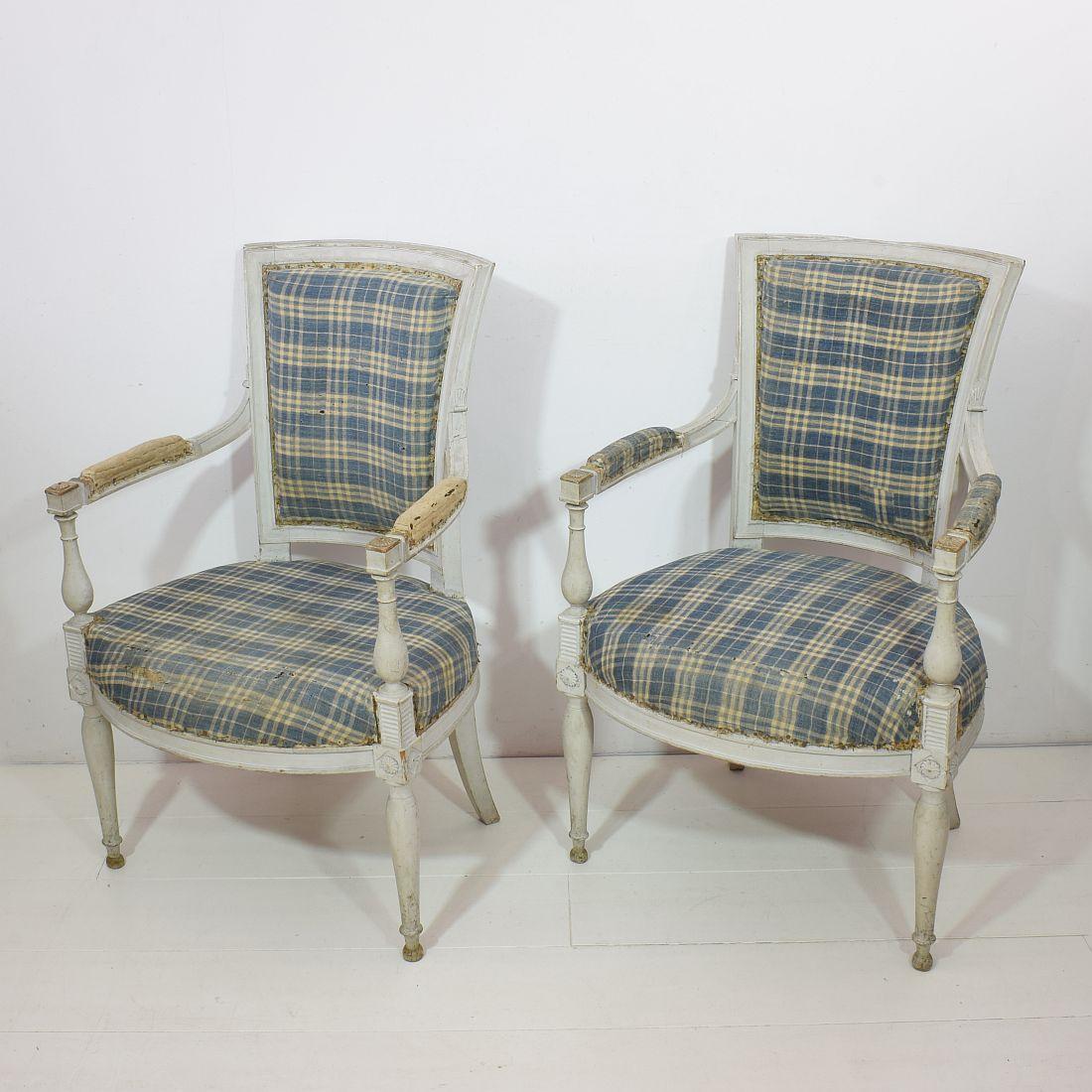 Beautiful pair of French original Directoire chairs, France, 18th century.
Measures: Seat height is 41 cm. Weathered, small losses and old repairs.
Despite of their high age, the chairs are in a relative good condition but could need some