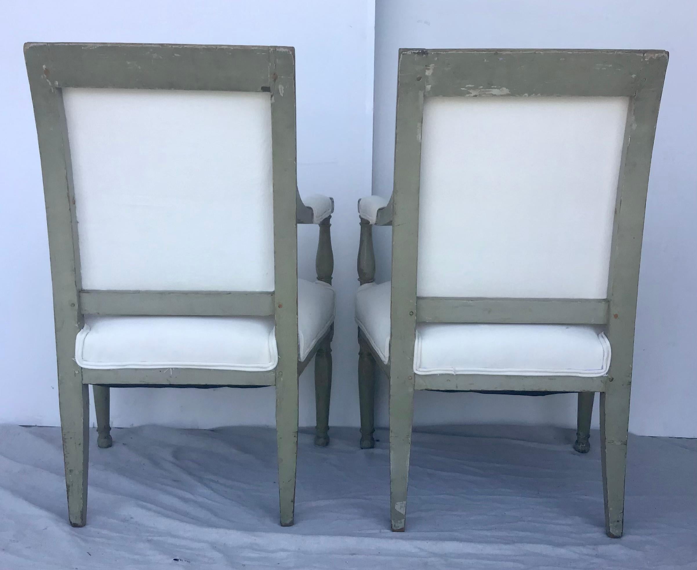 Beautiful pair of French original Directoire - Louis XVI chairs, France, 18th century. Original painted French Greenish gray with blue accents. All pegged construction, these came out of a Palm Beach estate and are solid and sturdy with a wonderful