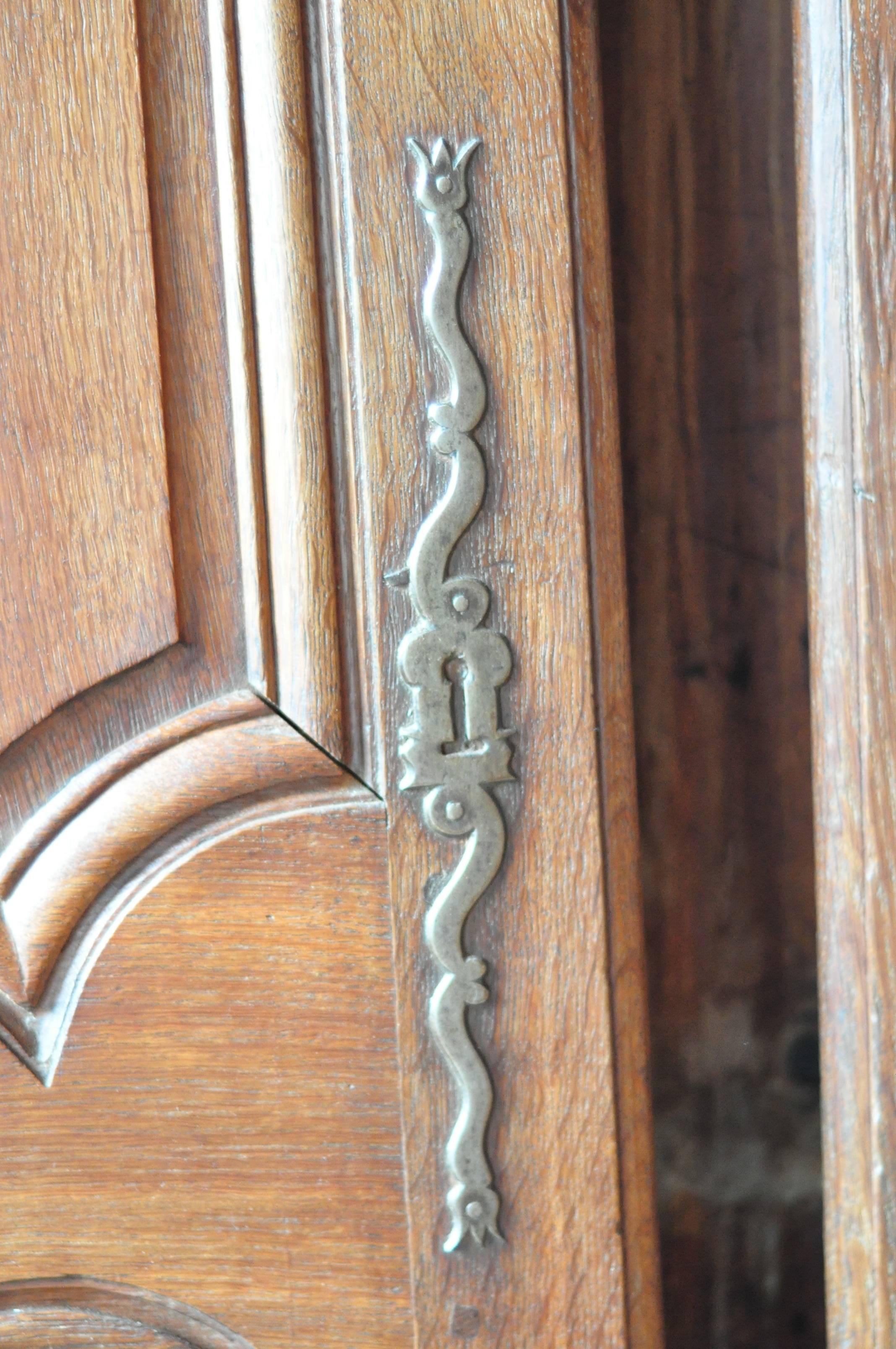 Stunning pair of oak doors in excellent condition featuring a remarkable lock. All hardware included.