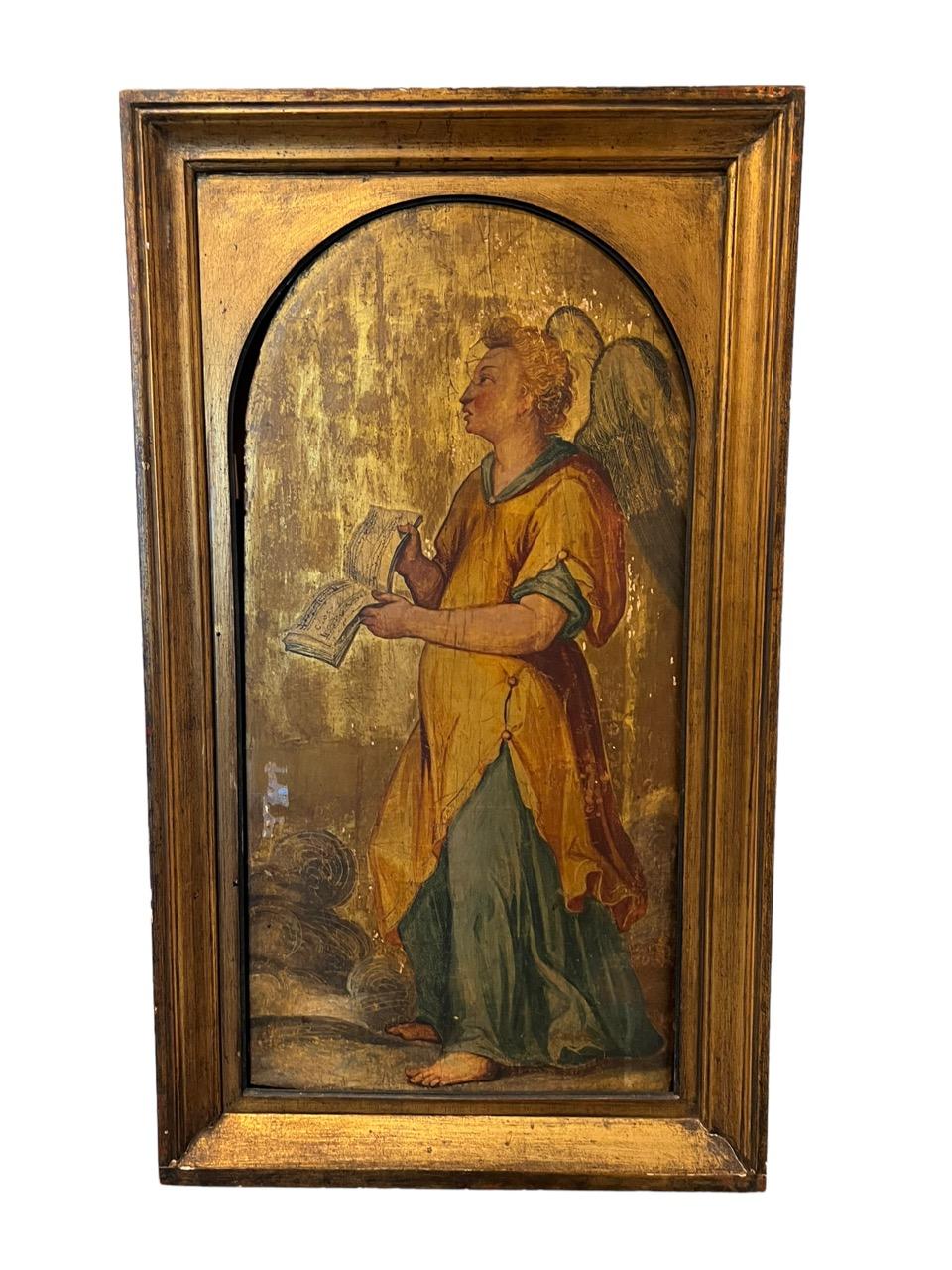 18th century French pair of oils on gold leaf panels. One is depicting an angel playing the violin, and the other one is holding the music book.