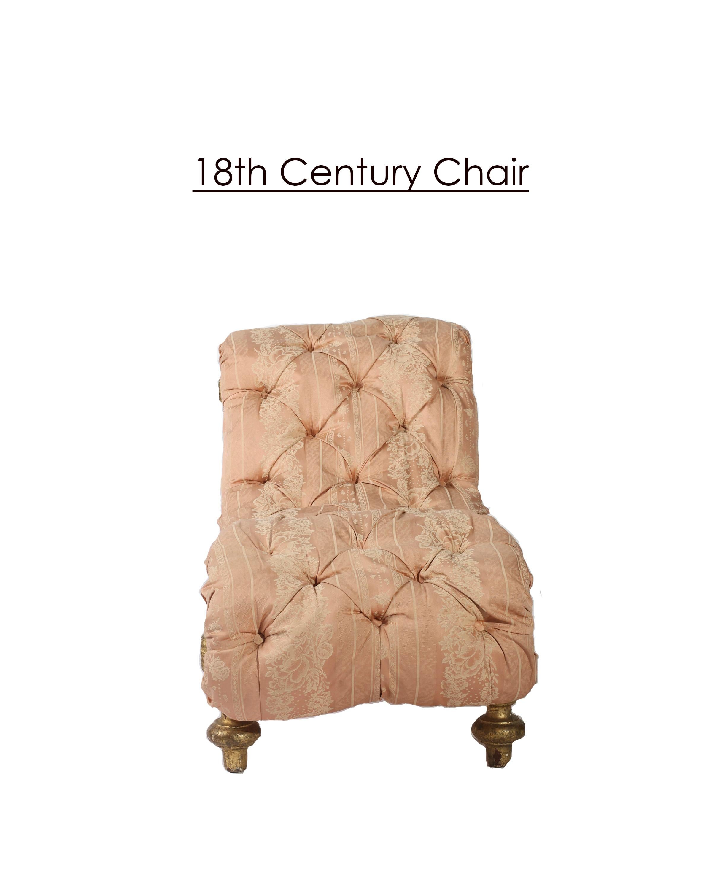 A lovely petite French chaise upholstered in tufted pink silk with some visible signs of wear, the curvaceous gilt base cradles the cloud of down filled tufted upholstery. Purchased from a chateau in France, this sweet small chaise would make a