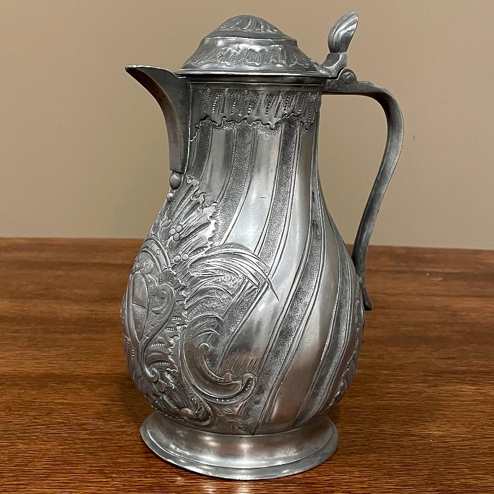 18th Century French Pewter Pitcher is an elaborately decorated example of fine craftsmanship in everyday items, using techniques that were passed down from generation to generation! Crafted from pewter, which is 92% tin, a metal valued for its