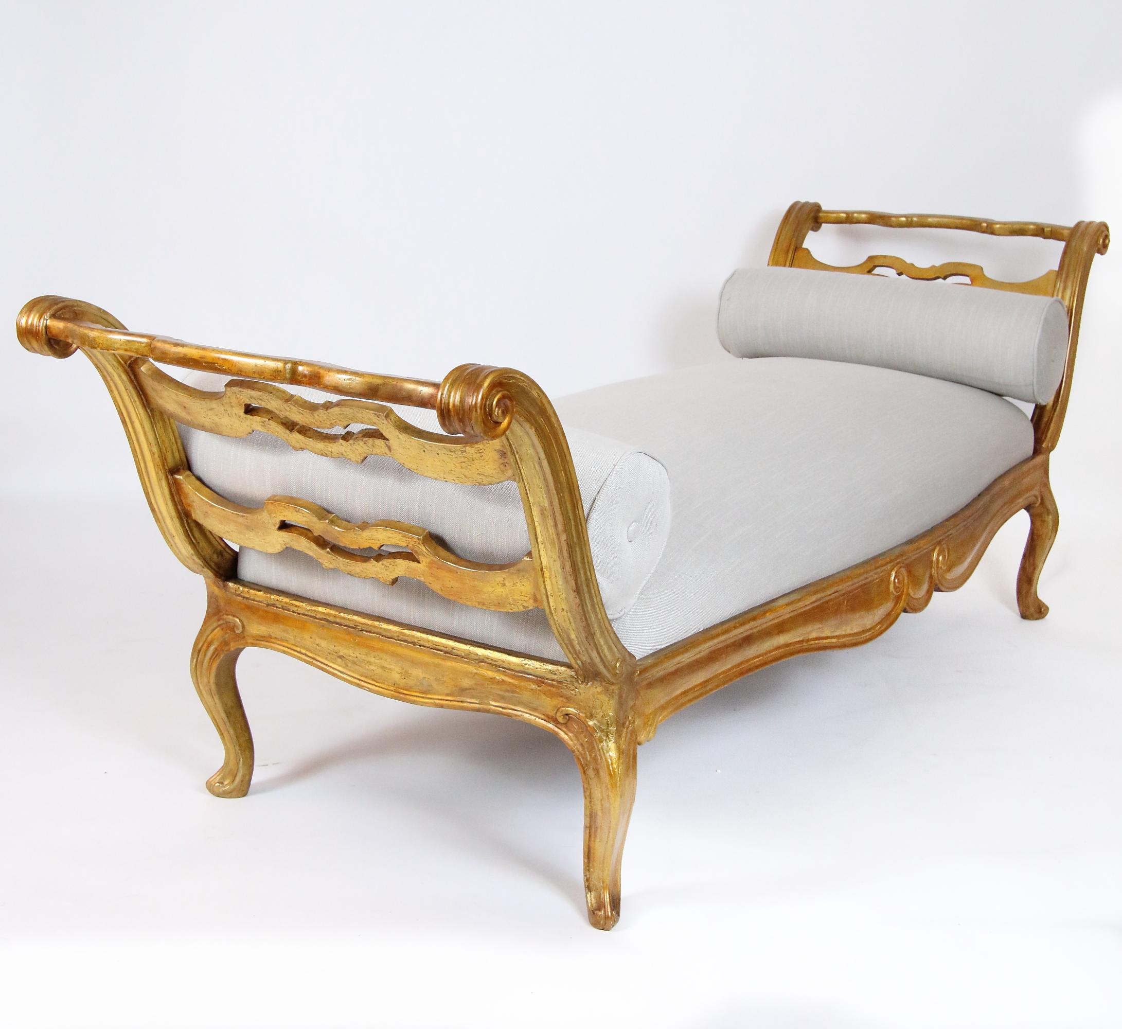 18th Century French/Provencal Louis XV Giltwood Bench or Daybed

Large Louis XV bench or day bed made of carved and gilt wood raised by four cabriole legs ending in scrolled feet. The front with a curvy frieze showing a central scroll decoration,
