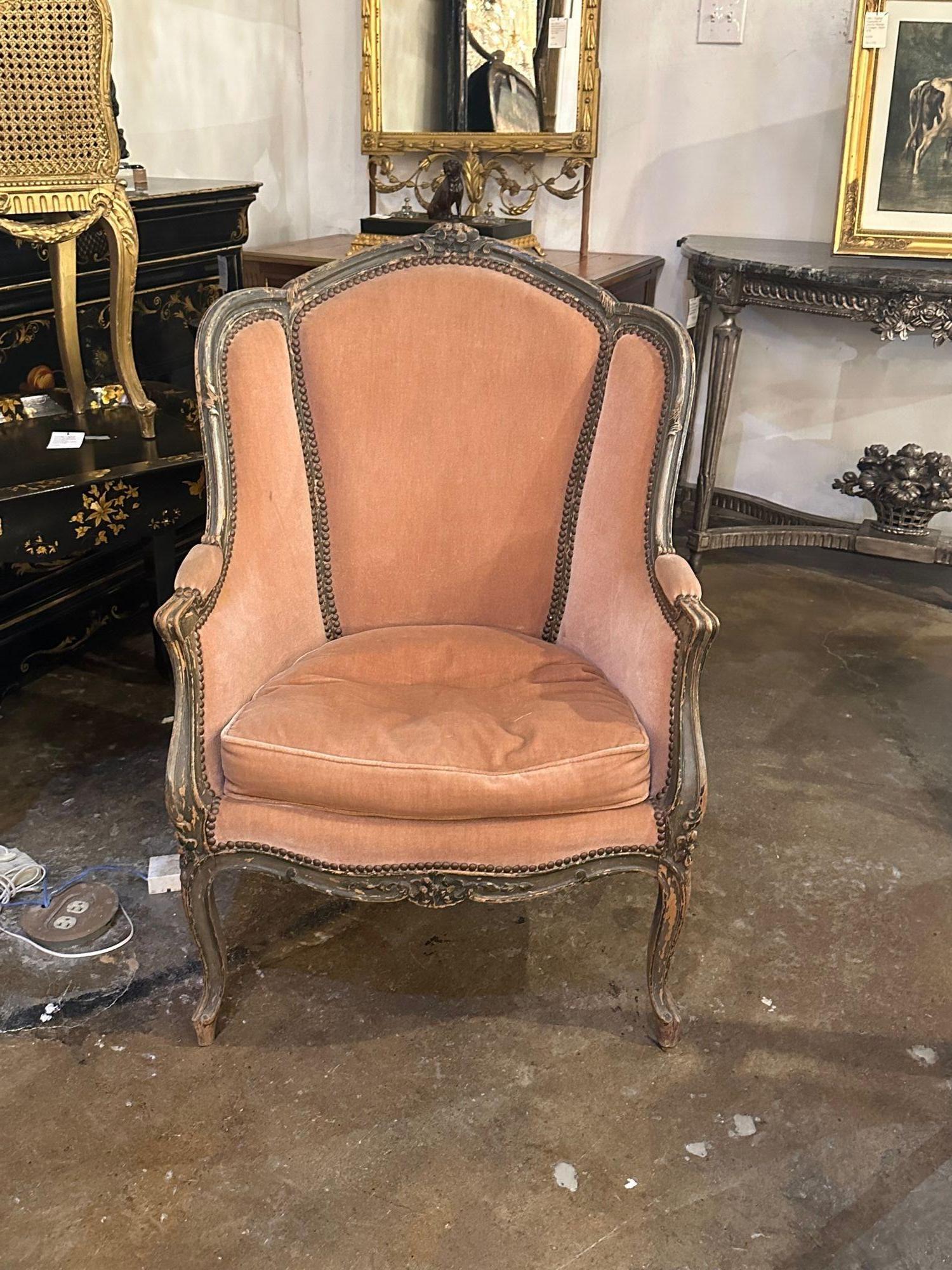 Lovely 18th century French Provincial carved and painted Bergere with blush velvet. A very fine piece with beautiful craftsmanship.  Outstanding!
