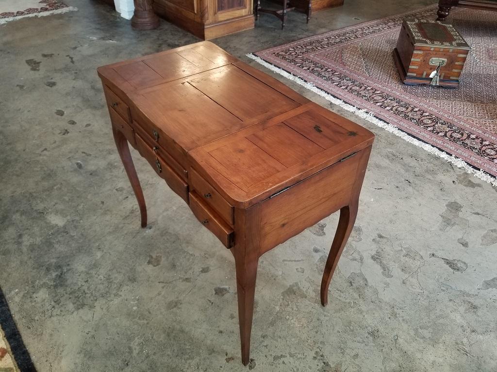 Presenting an extremely rare 18th century French Provincial cherrywood poudreuse with impeccable provenance.

From circa 1790 and made of cherrywood, this beautifully proportioned poudreuse or vanity table is oblong/rectangular in shape. The top