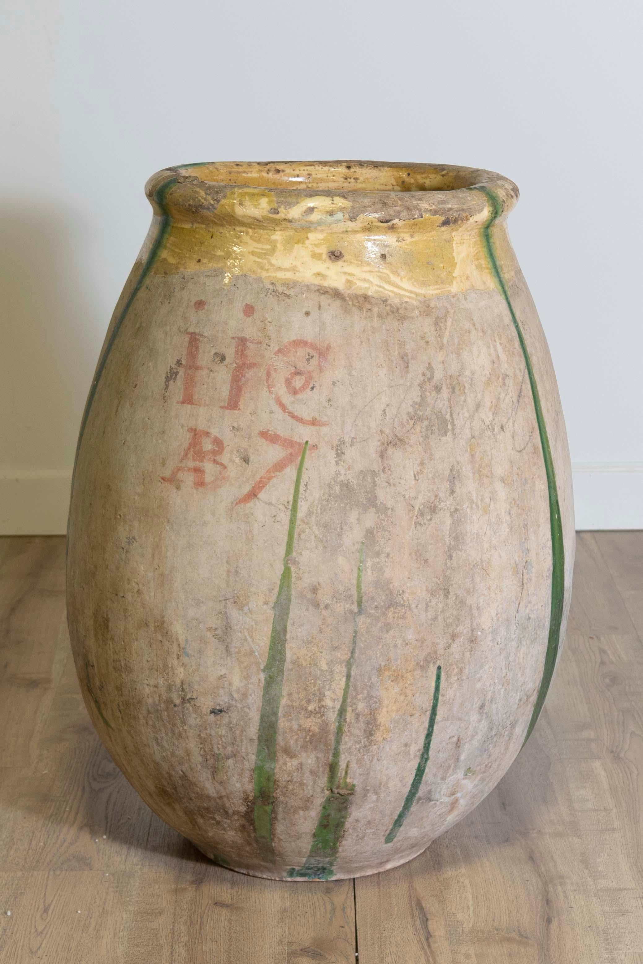 Glazed 18th Century French Provincial Olive Oil Biot jar with Yellow and Green Glaze For Sale
