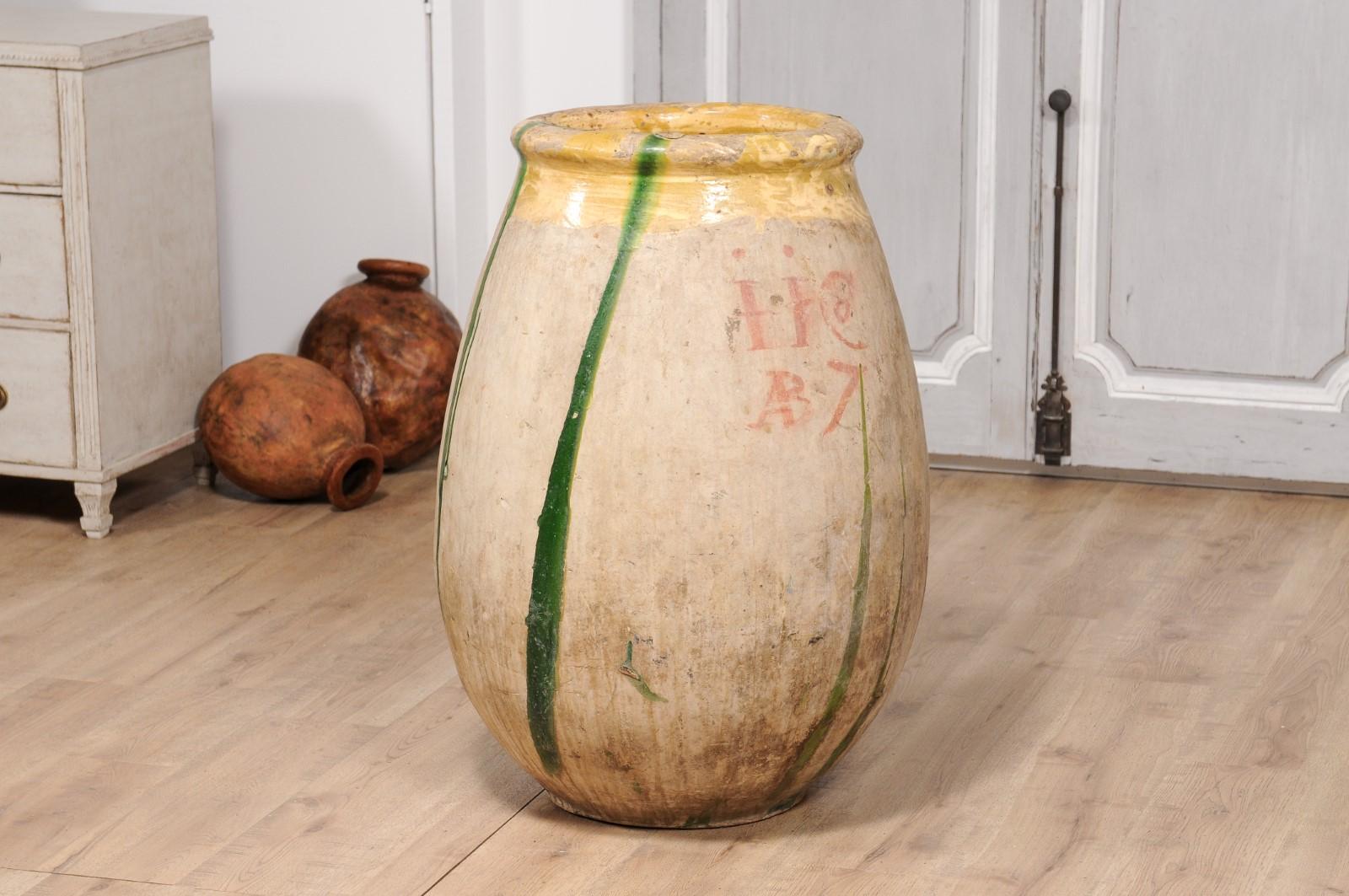 18th Century and Earlier 18th Century French Provincial Olive Oil Biot jar with Yellow and Green Glaze For Sale