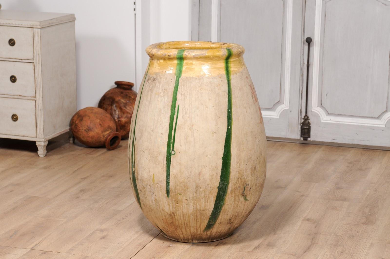 Terracotta 18th Century French Provincial Olive Oil Biot jar with Yellow and Green Glaze For Sale