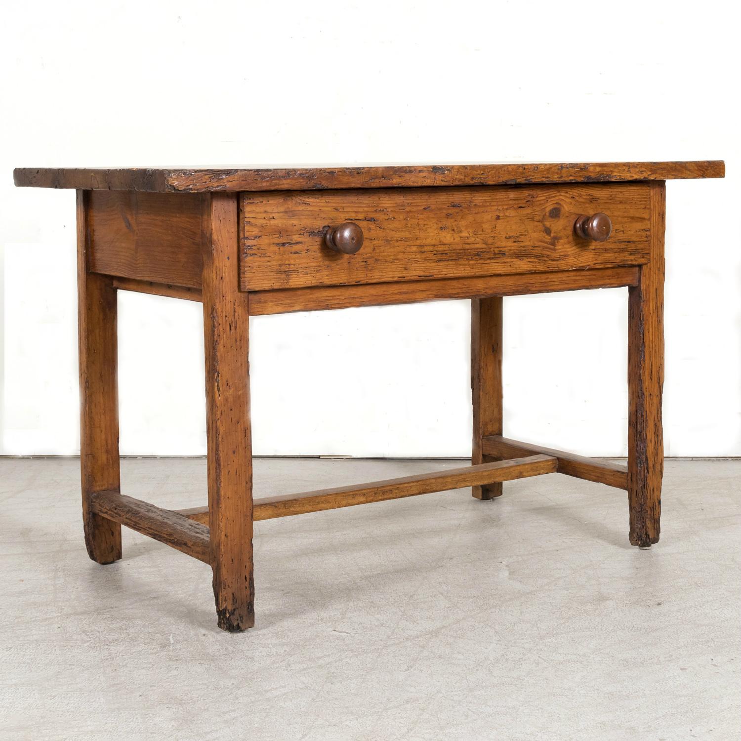 A wonderful 18th century French provincial primitive larch wood side table or desk, circa 1770s, handcrafted near Abondance, an attractive alpine village in the Haute-Savoie department in the Auvergne-Rhône-Alpes region in southeastern France just