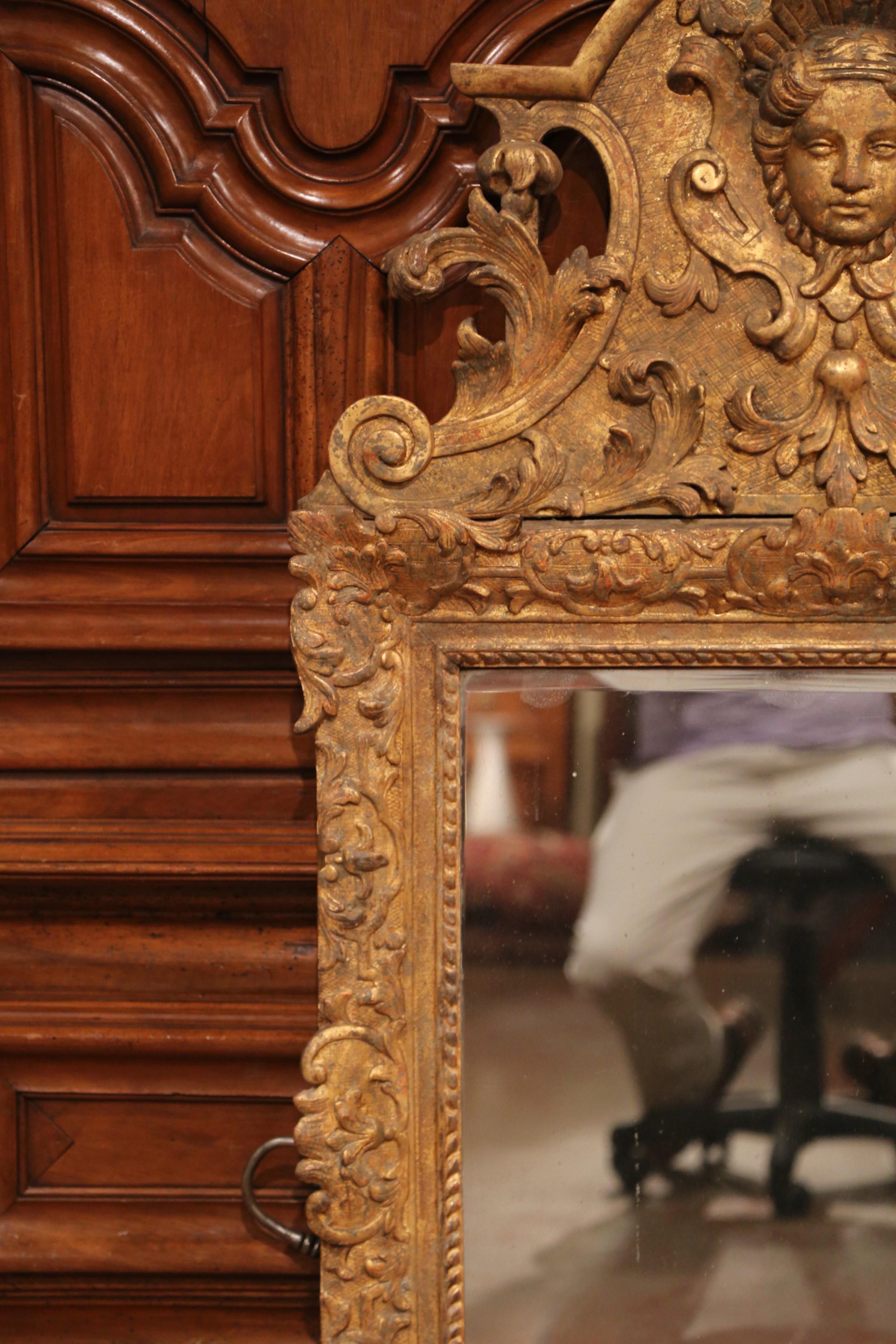 Hand-Carved 18th Century French Regence Carved Giltwood Wall Mirror with Ornate Pediment For Sale