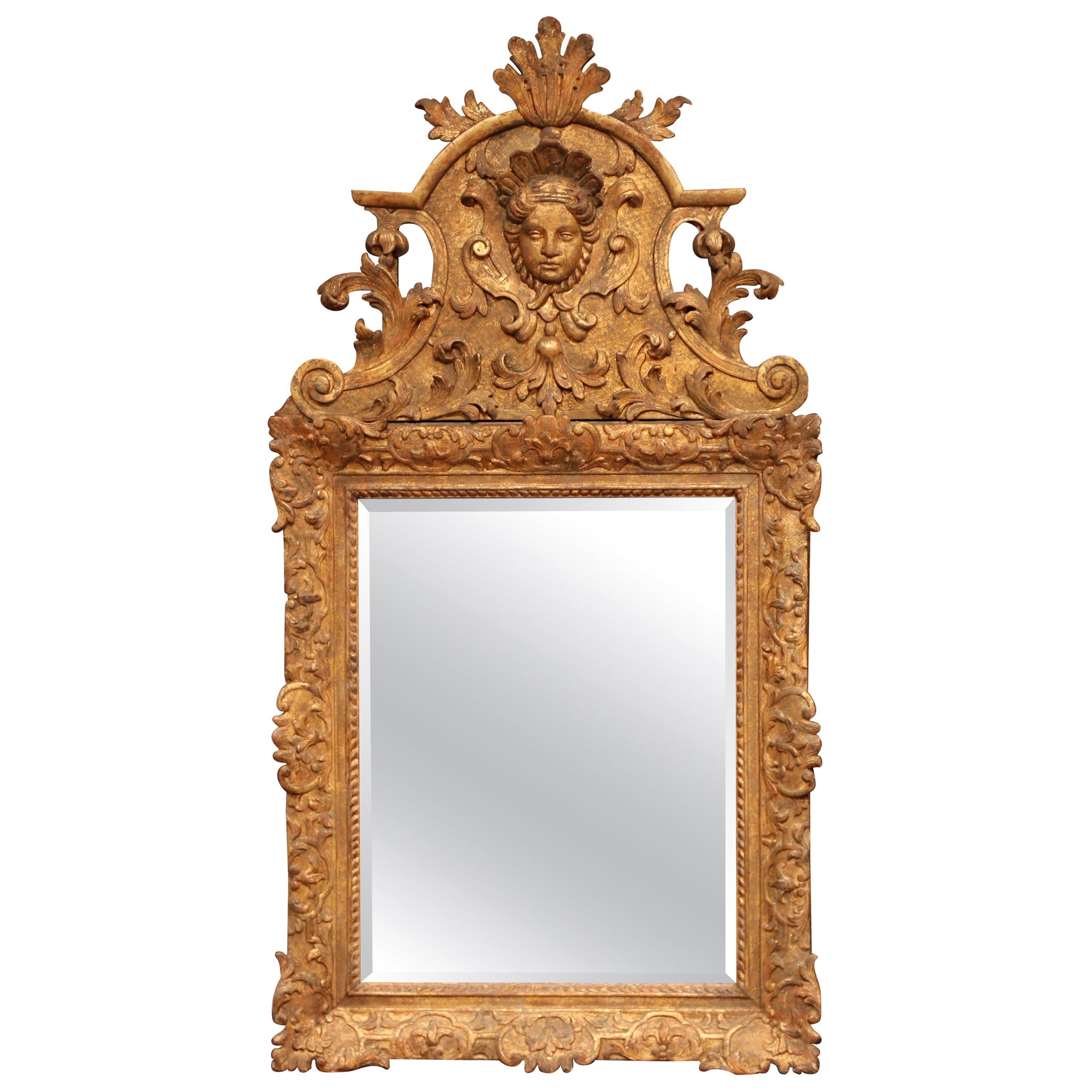 18th Century French Regence Carved Giltwood Wall Mirror with Ornate Pediment