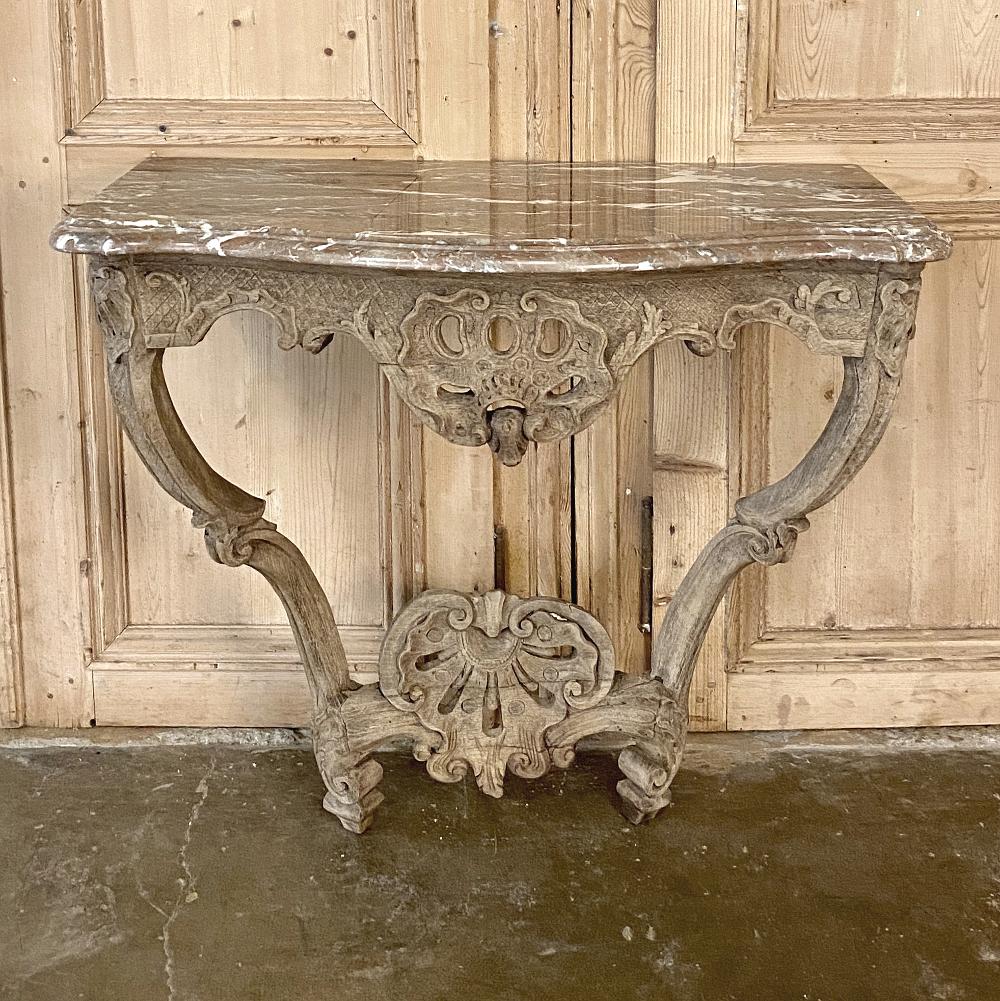 18th Century French Regence Marble Top Console is the perfect way to add timeless elegance to your entryway, hall or any niche!  Sculpted from old-growth oak and left in a natural wood finish, it features lavishly carved shell and foliate designs