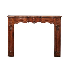 18th Century French Regence Style Walnut Mantle with Shell Carving