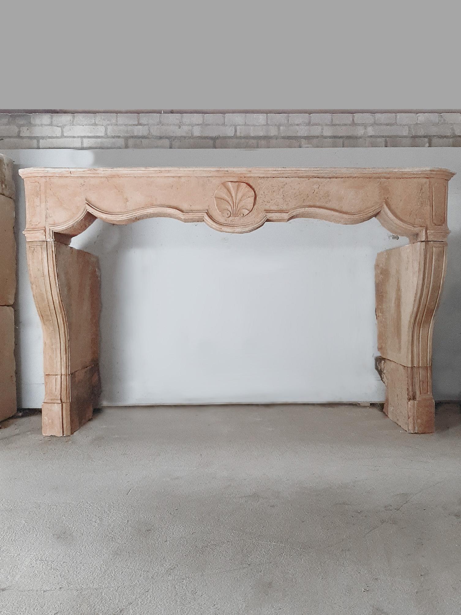 18th century French Regency (Régence) mantelpiece, made of peach colored limestone.

The Régence was the period in French history between 1715 and 1723, when King Louis XV was a minor and the country was governed by Philippe d'Orléans.

The