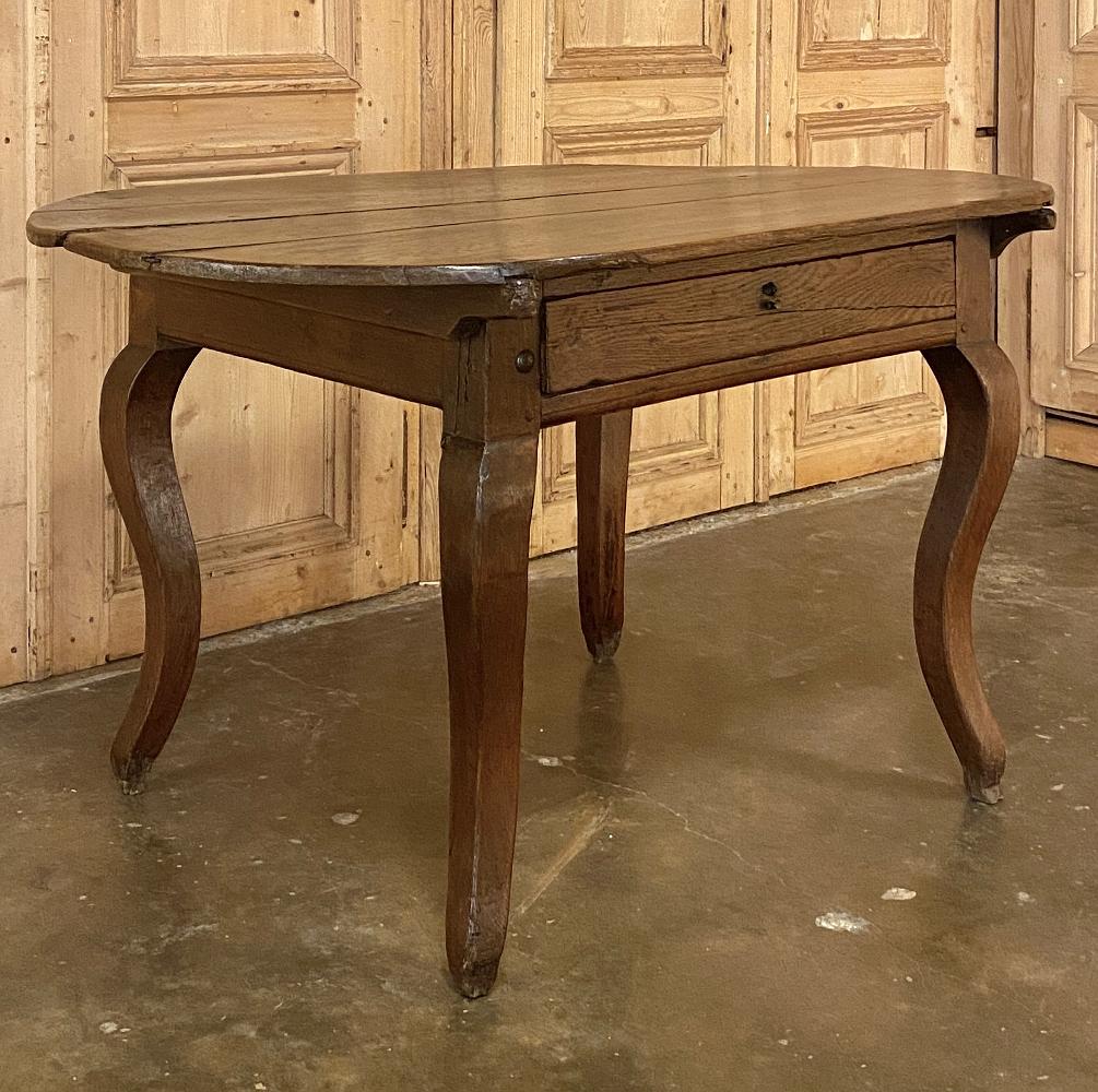 18th century French rustic writing table was crafted from a country home, probably owned by a noble or dignitary, who brought some of the concepts of convenient and 
